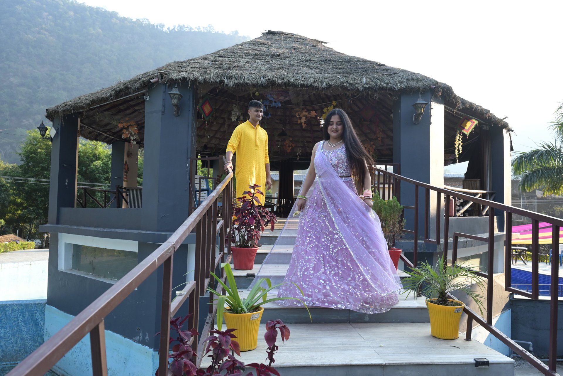 woman wearing yellow long-sleeved dress under white clouds and blue sky during daytime