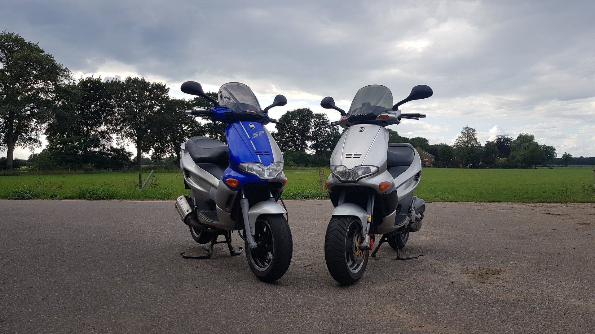 black and brown leather padded tub sofa