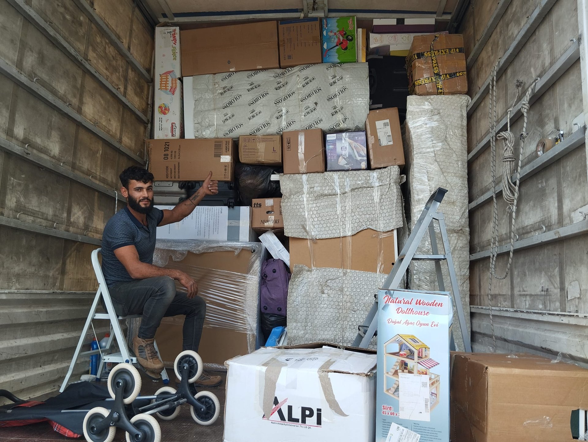 woman wearing yellow long-sleeved dress under white clouds and blue sky during daytime