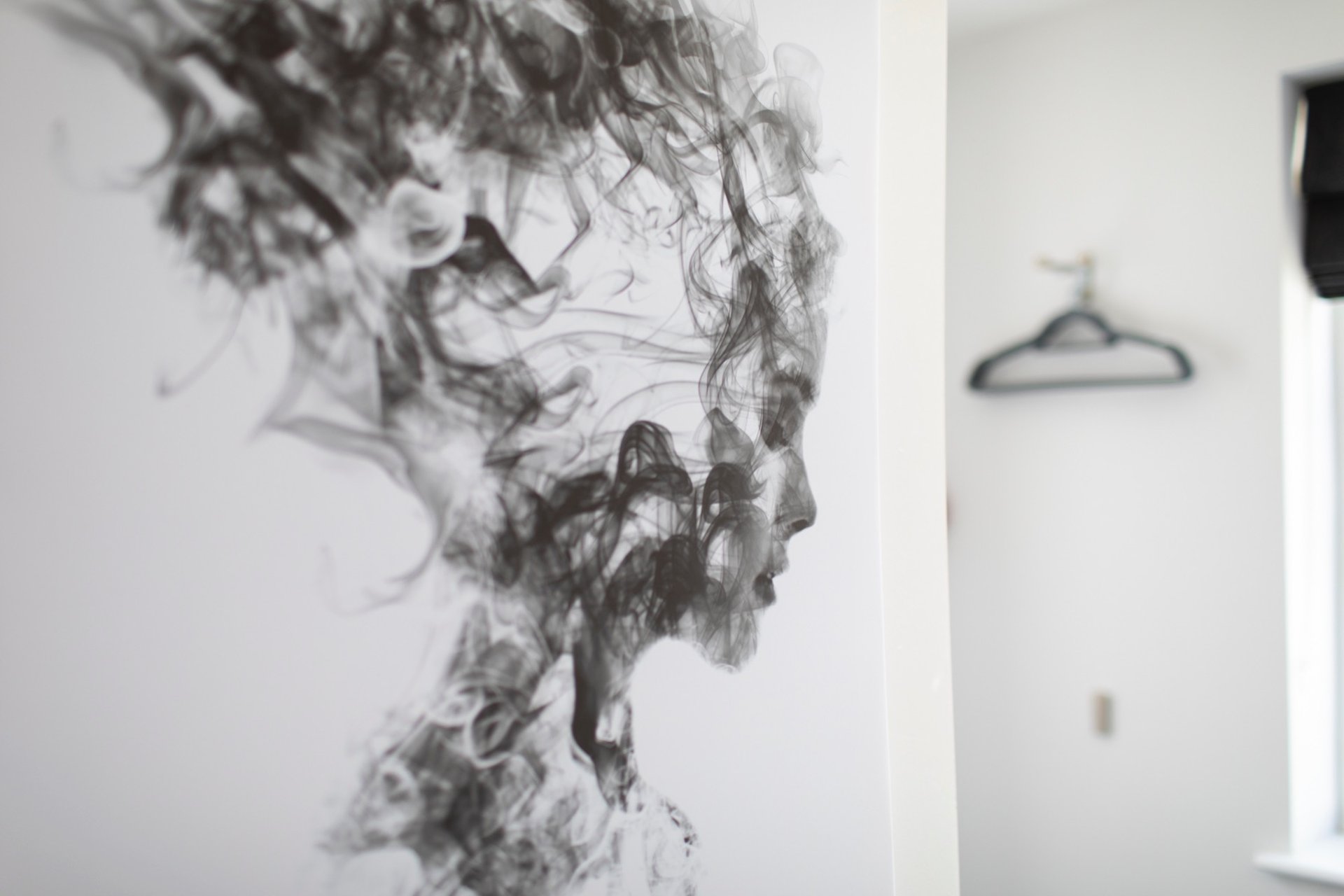 woman in white crew neck shirt wearing brown sun hat