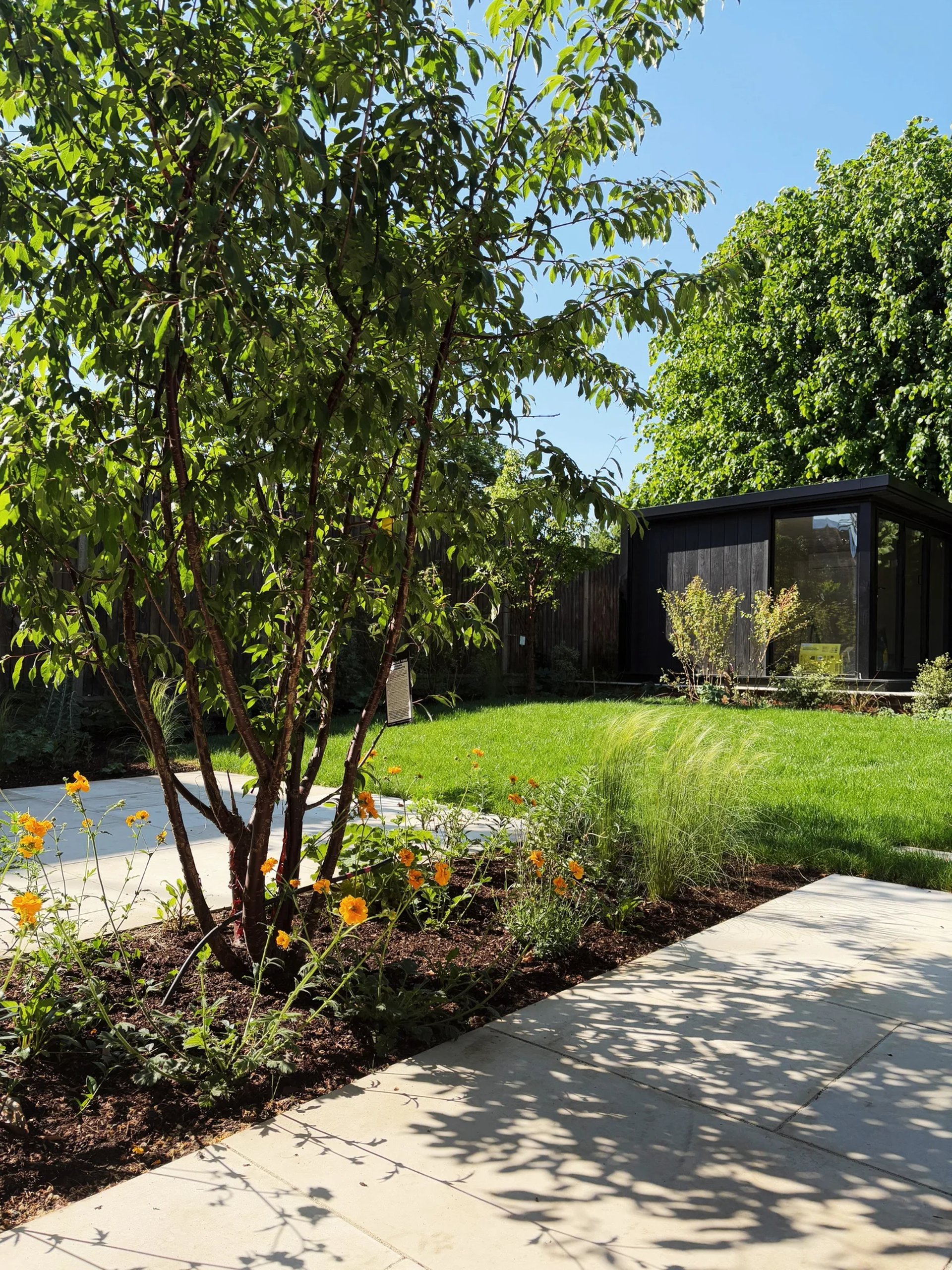 an abstract photo of a curved building with a blue sky in the background