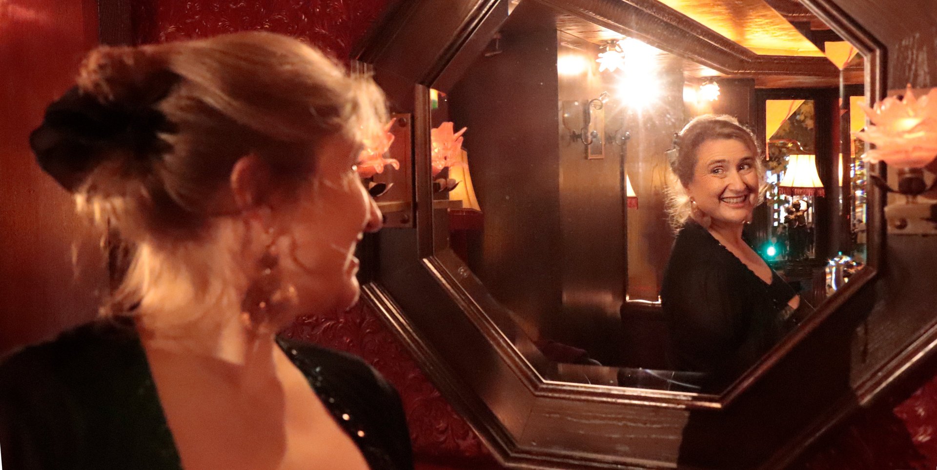 an abstract photo of a curved building with a blue sky in the background