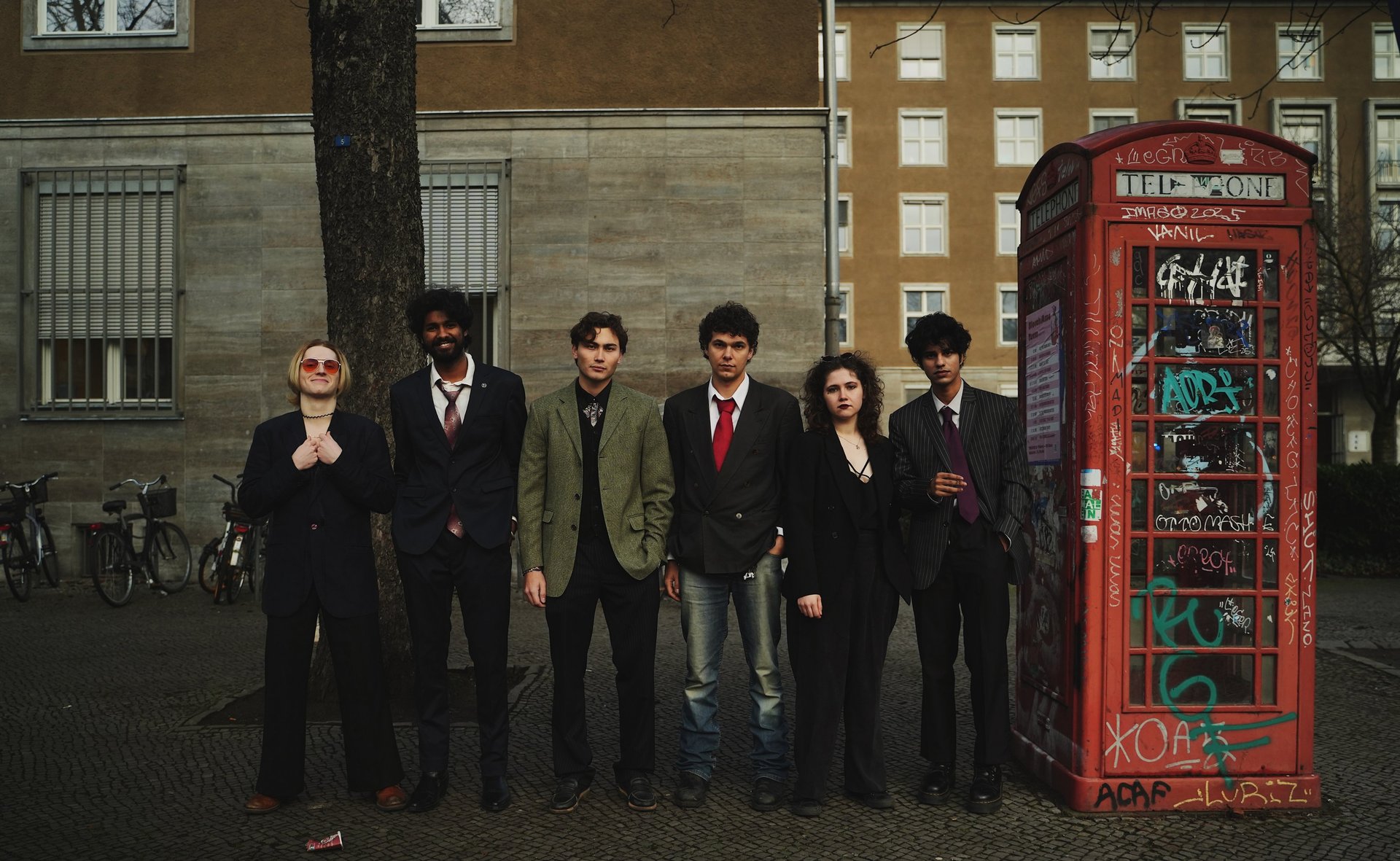 an abstract photo of a curved building with a blue sky in the background