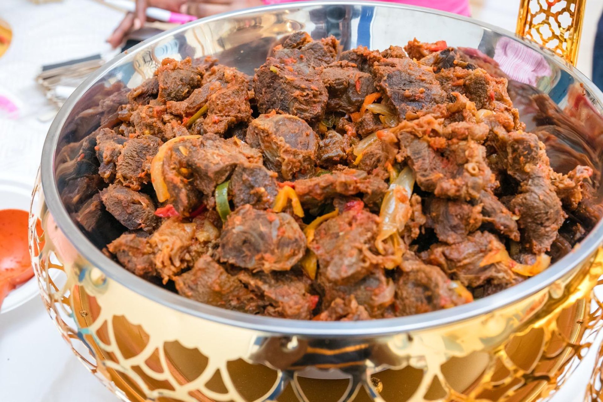 an abstract photo of a curved building with a blue sky in the background
