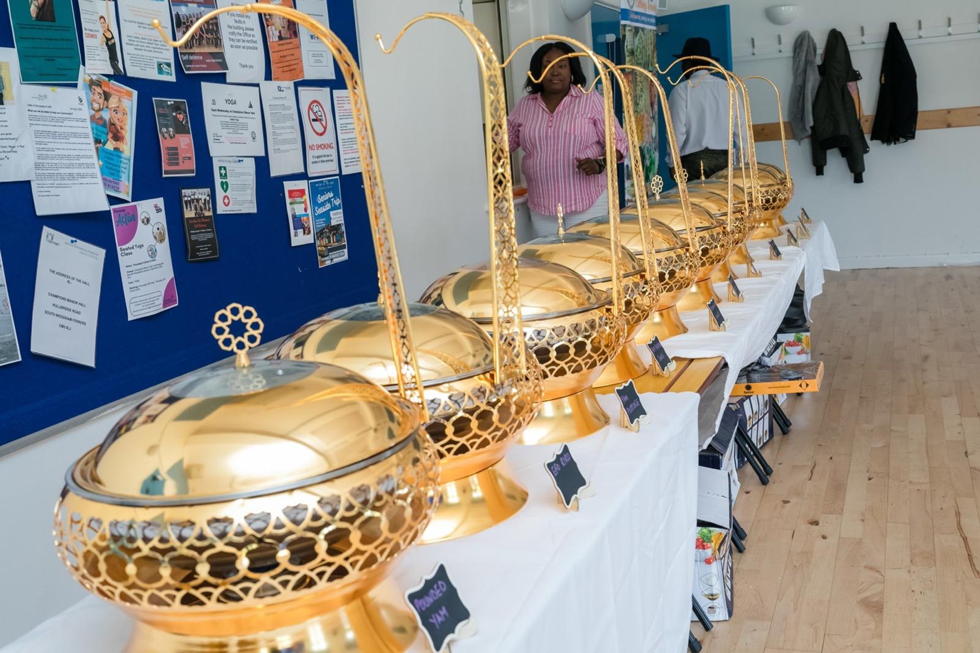an abstract photo of a curved building with a blue sky in the background