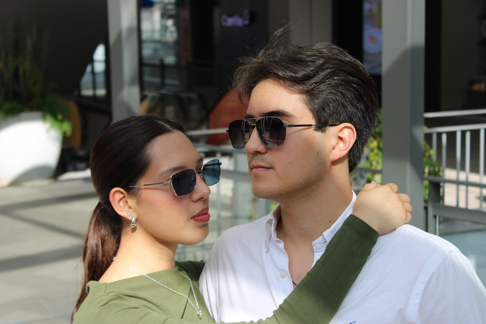 an abstract photo of a curved building with a blue sky in the background