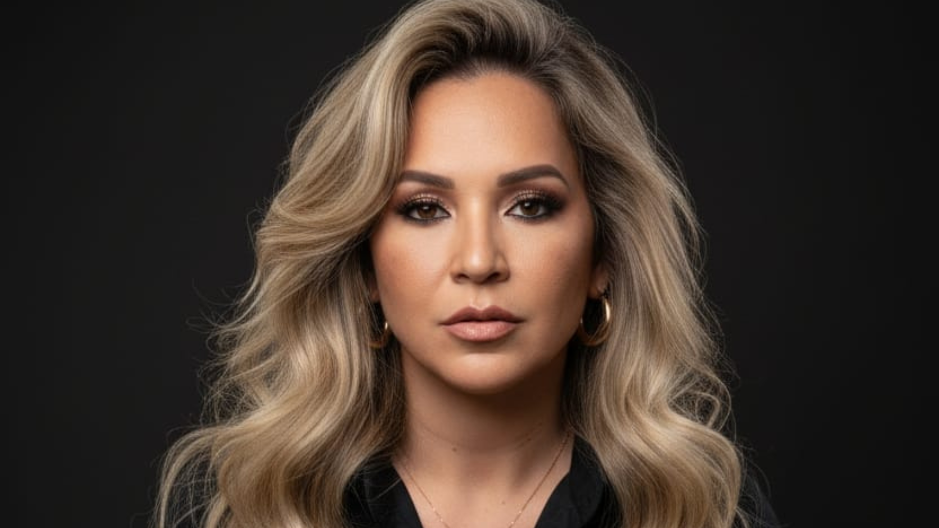 an abstract photo of a curved building with a blue sky in the background