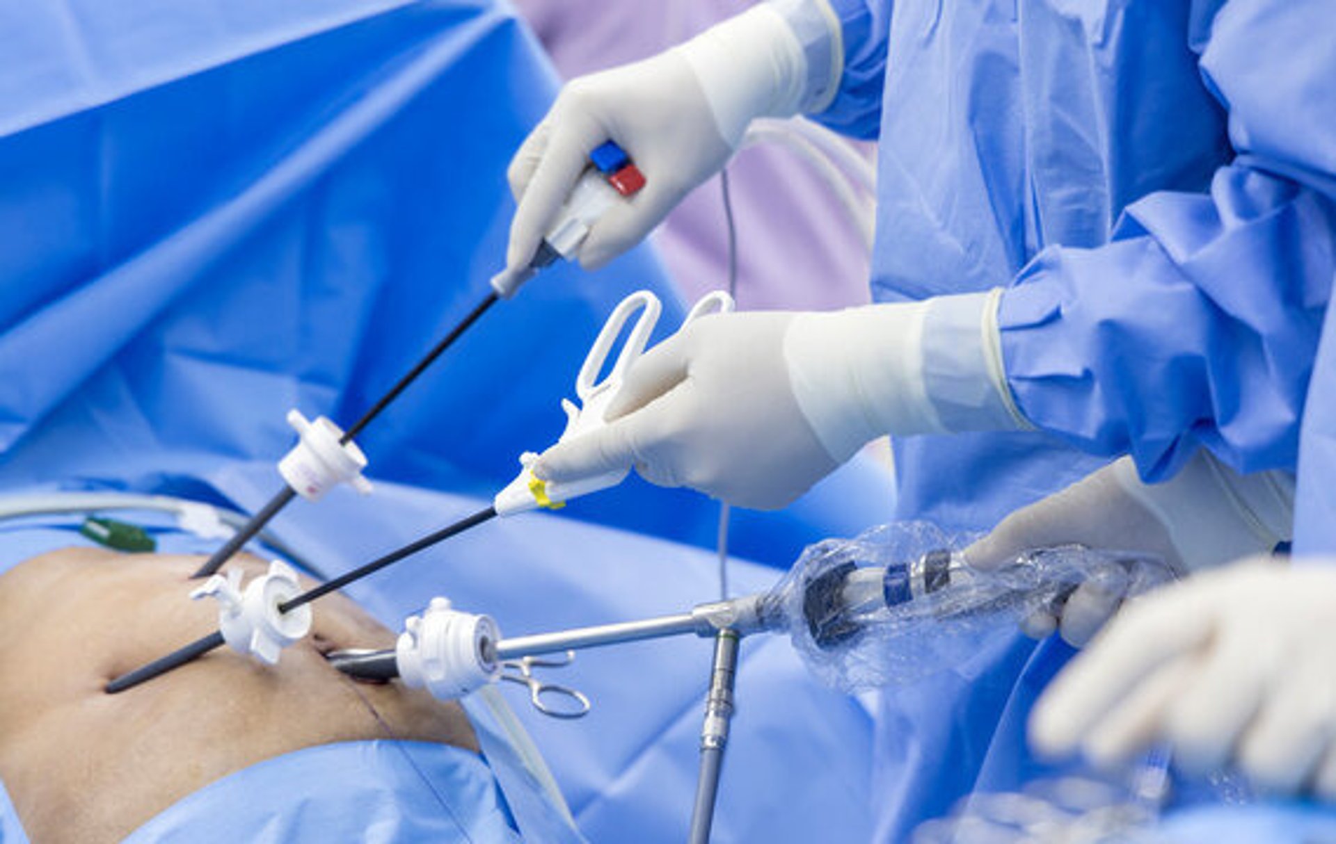 a person operating a medical light in a room