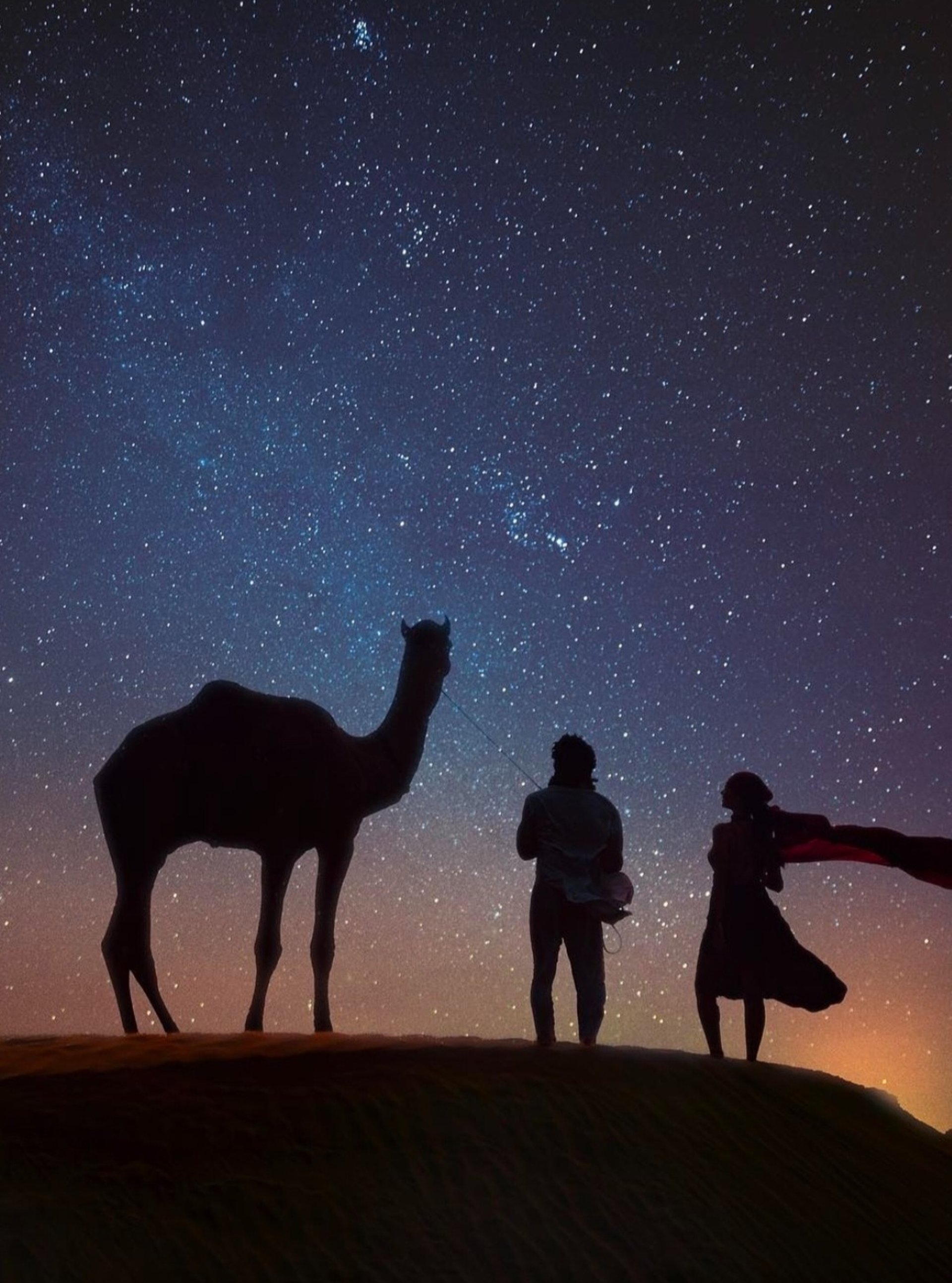 woman in black pants standing on window during daytime