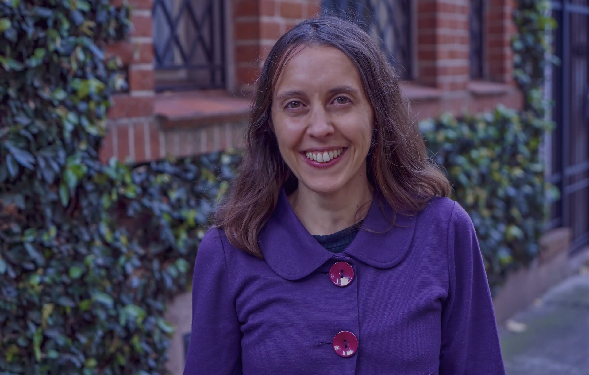 an abstract photo of a curved building with a blue sky in the background