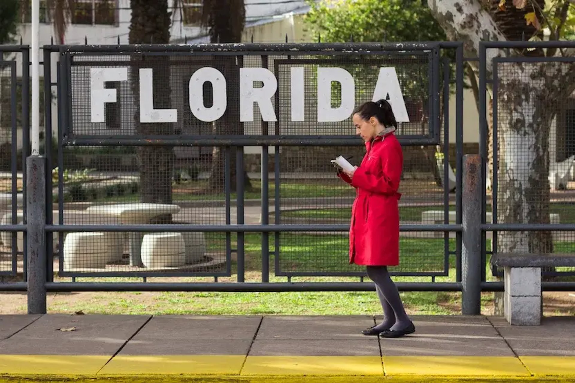 an abstract photo of a curved building with a blue sky in the background