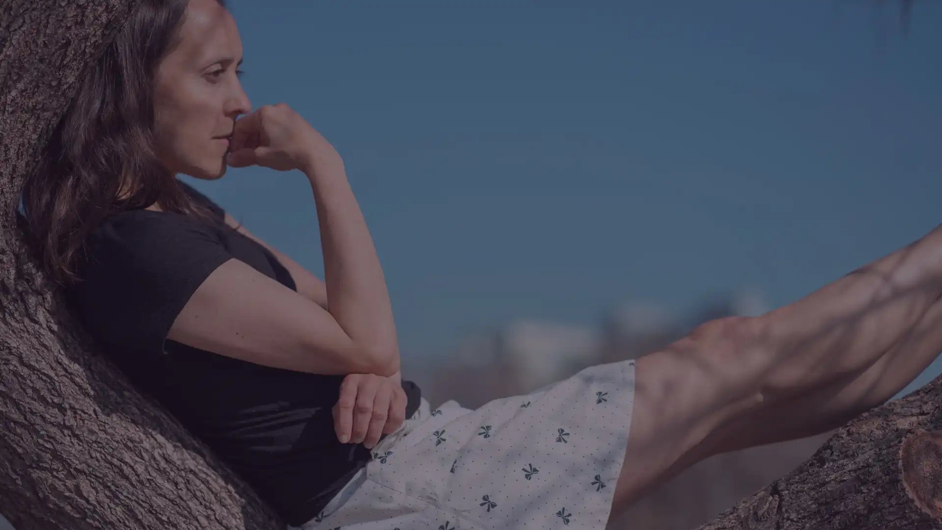 an abstract photo of a curved building with a blue sky in the background