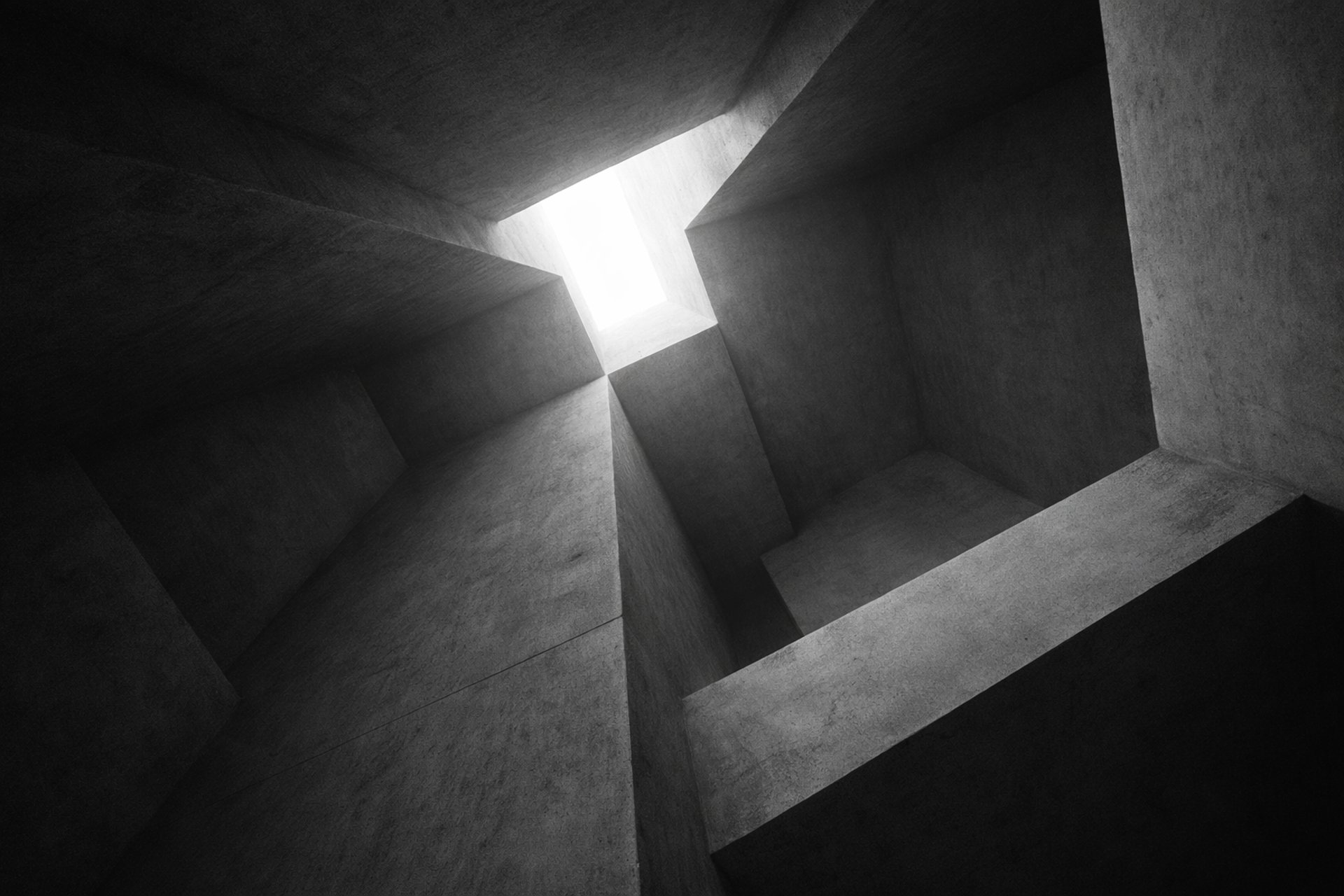 person in white shirt standing in front of mirror