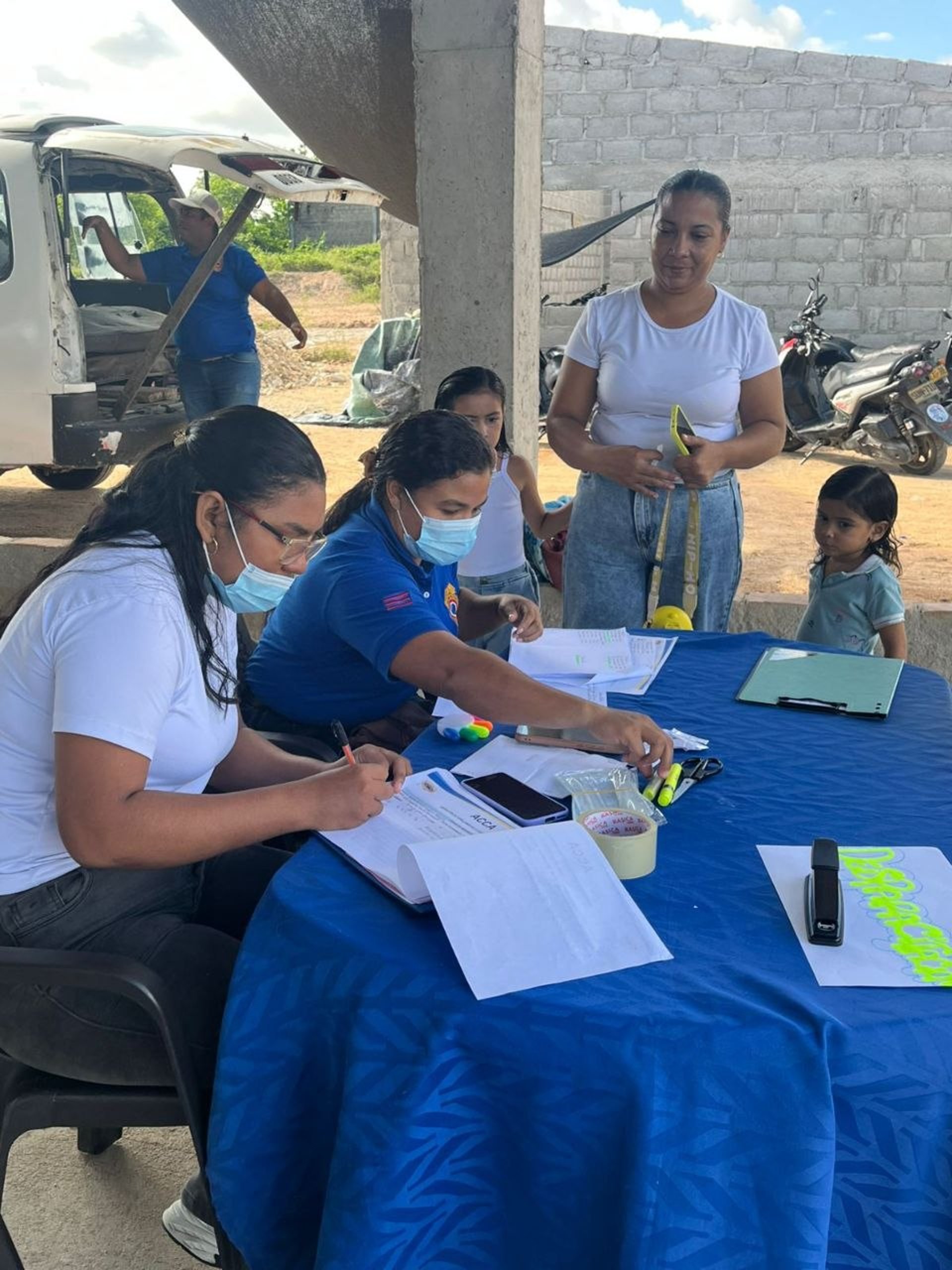 woman wearing yellow long-sleeved dress under white clouds and blue sky during daytime