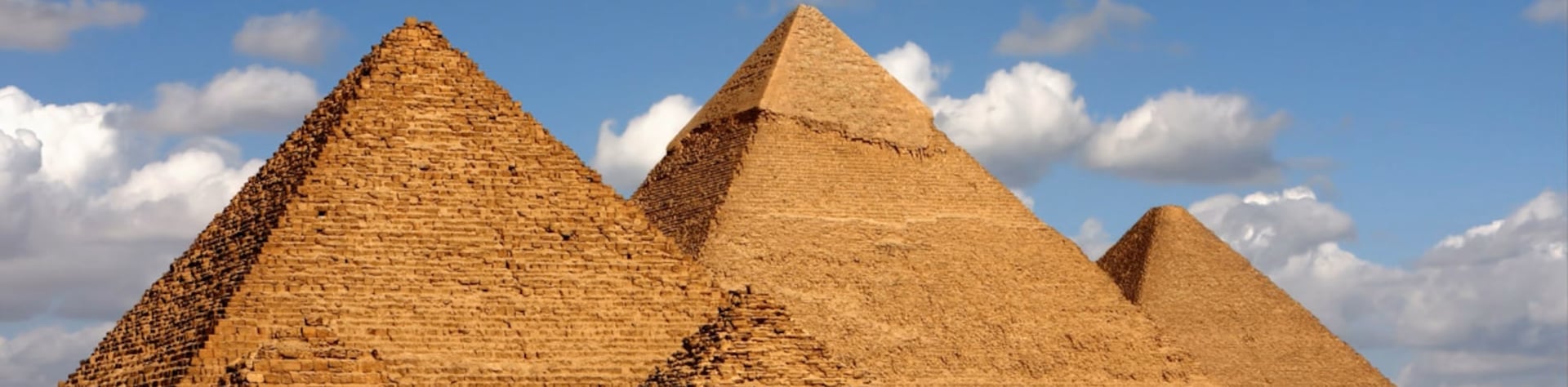 brown pyramid under blue sky during daytime