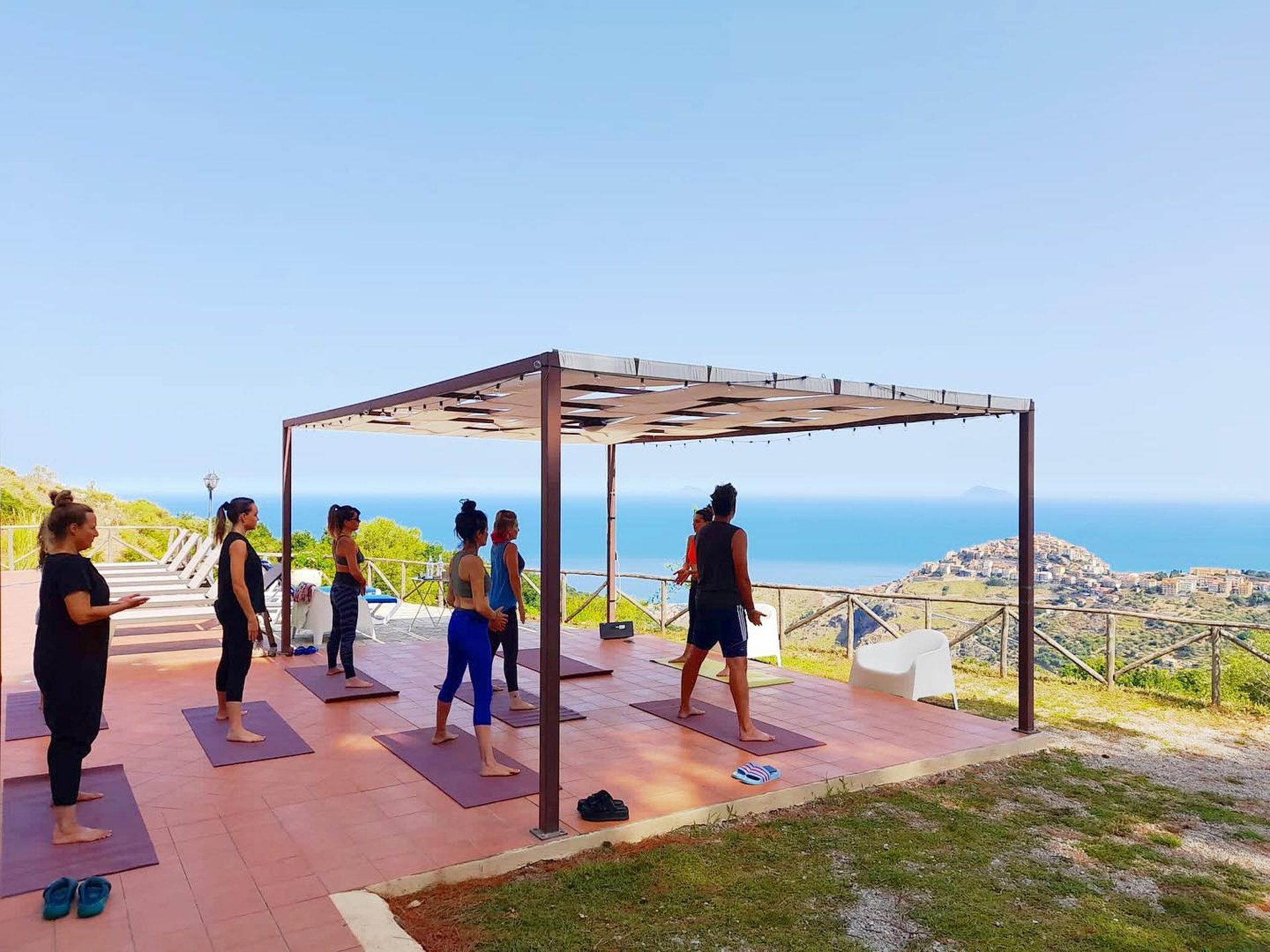 an abstract photo of a curved building with a blue sky in the background