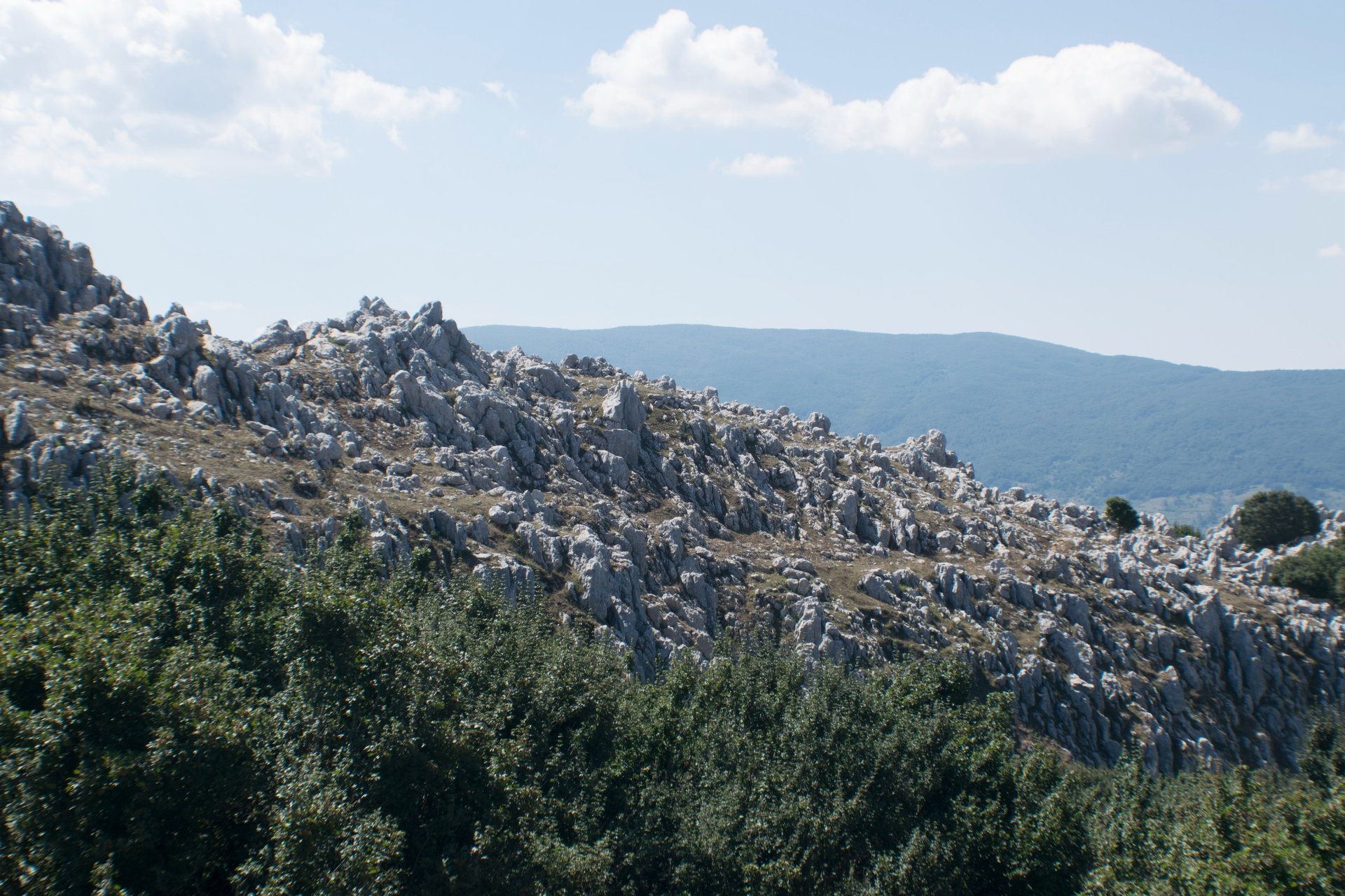 a view of a mountain range at sunset