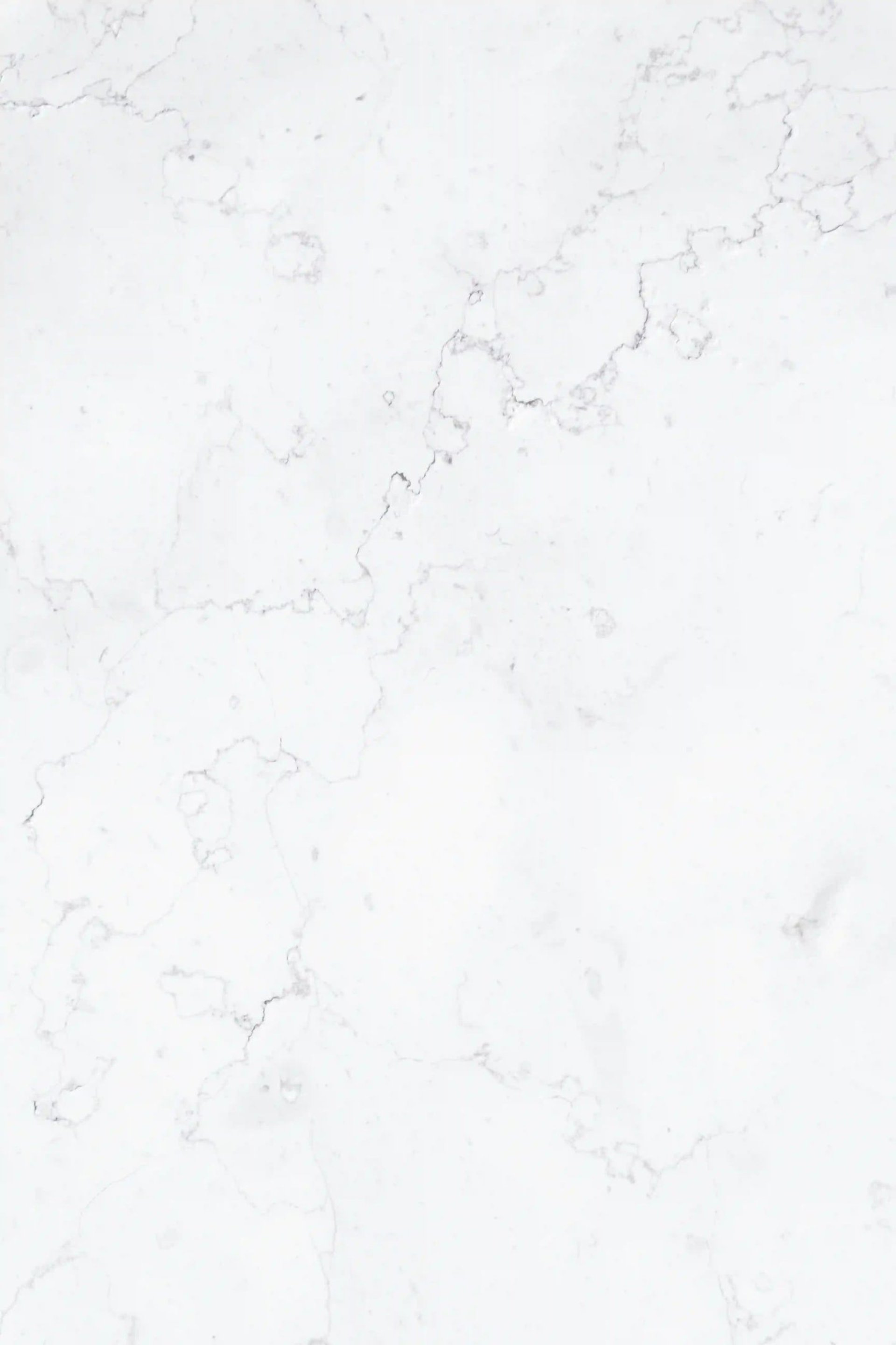 a close up of a white marble surface