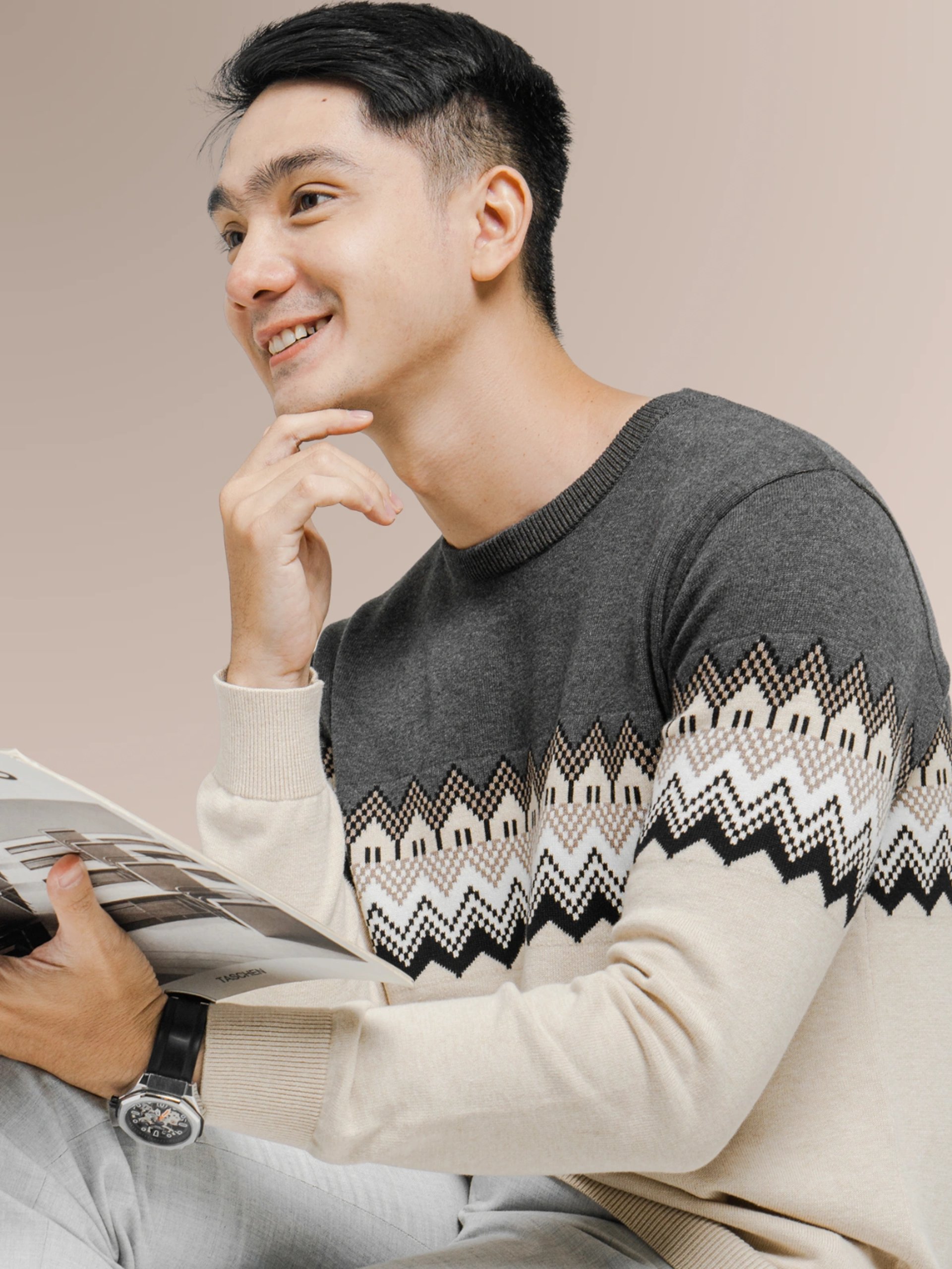 person wearing grey knit sweater