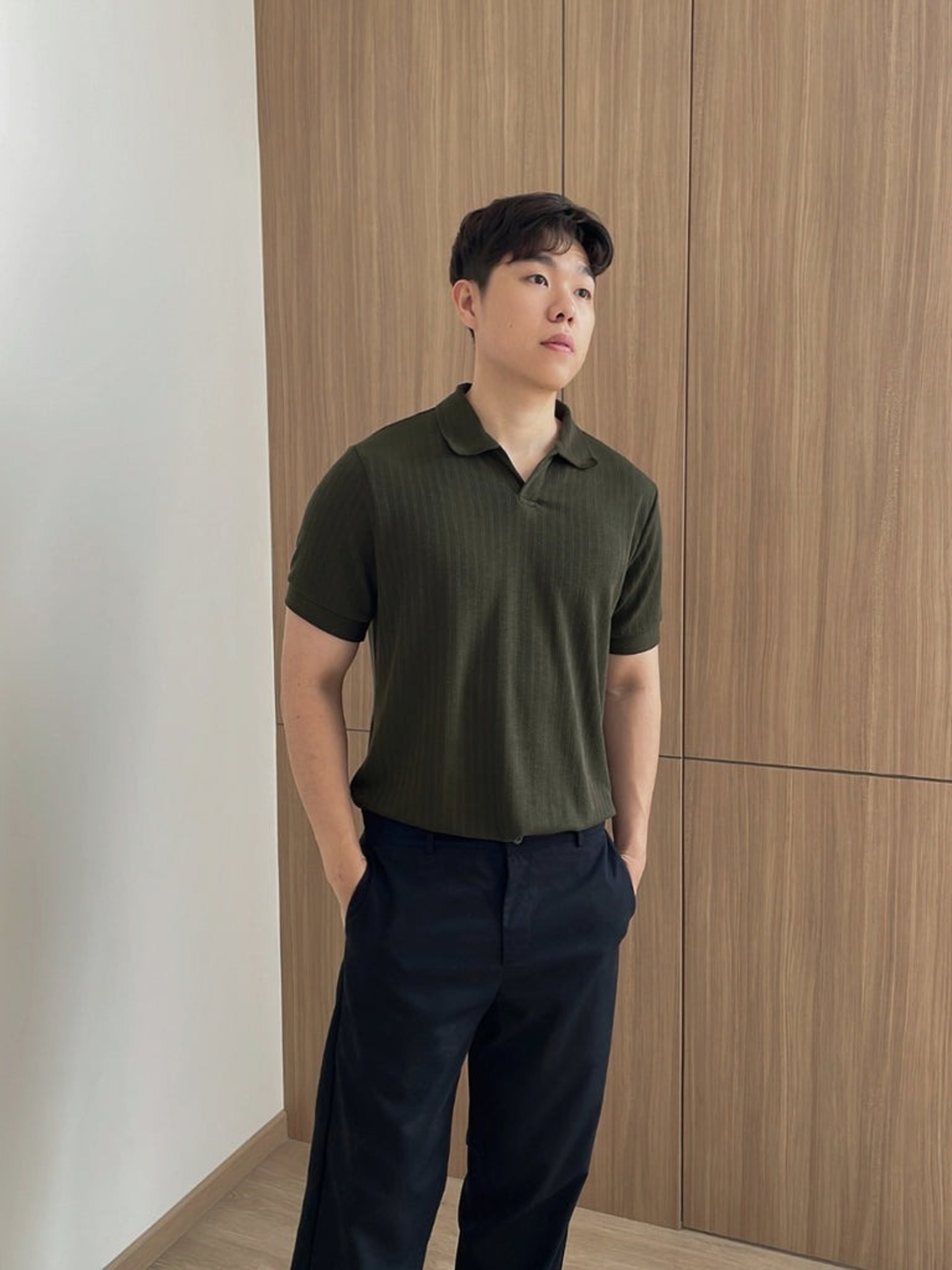 person wearing grey knit sweater