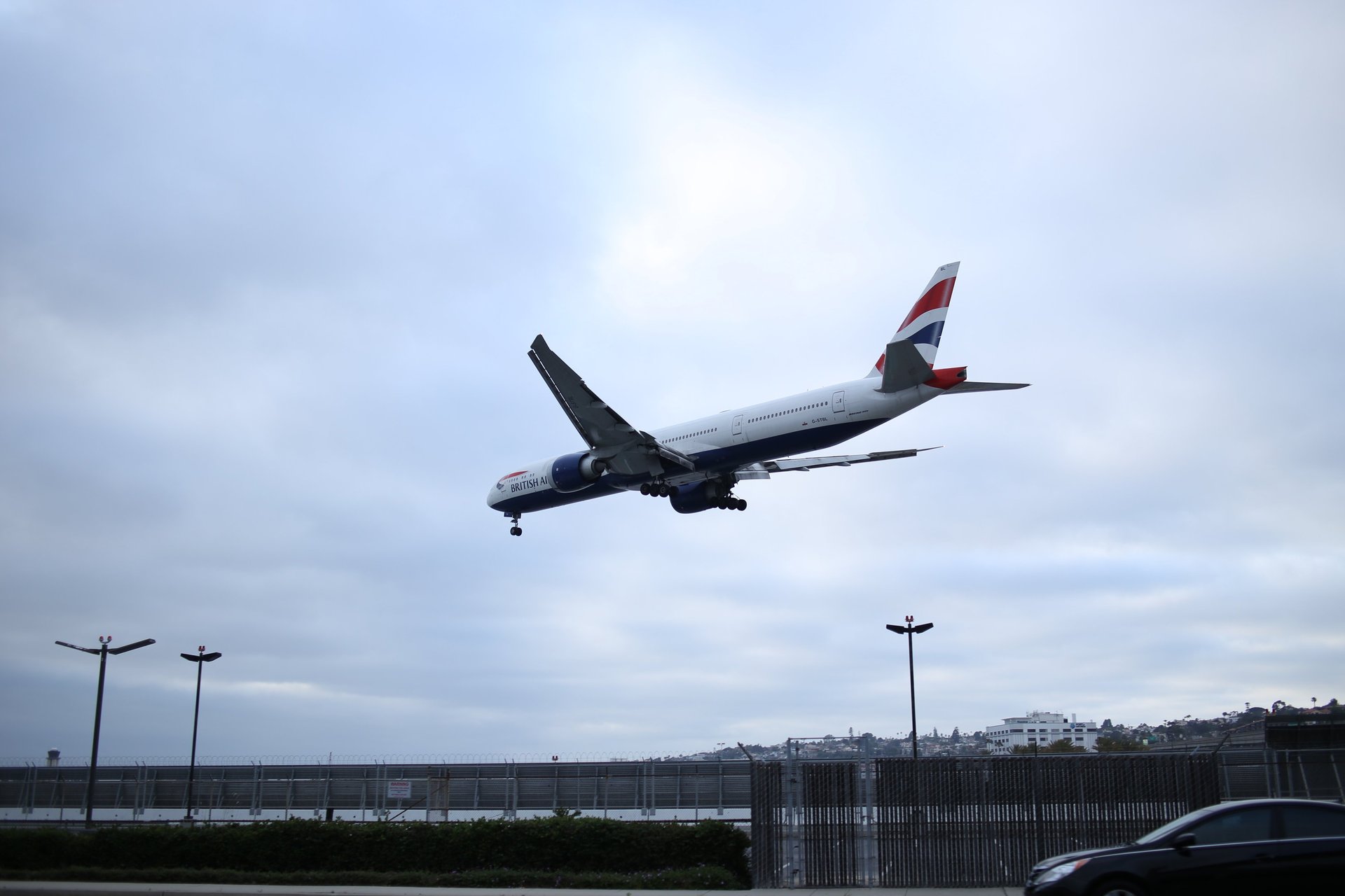 woman wearing yellow long-sleeved dress under white clouds and blue sky during daytime