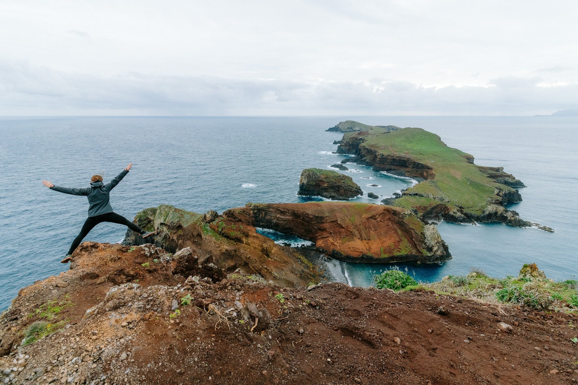 an abstract photo of a curved building with a blue sky in the background
