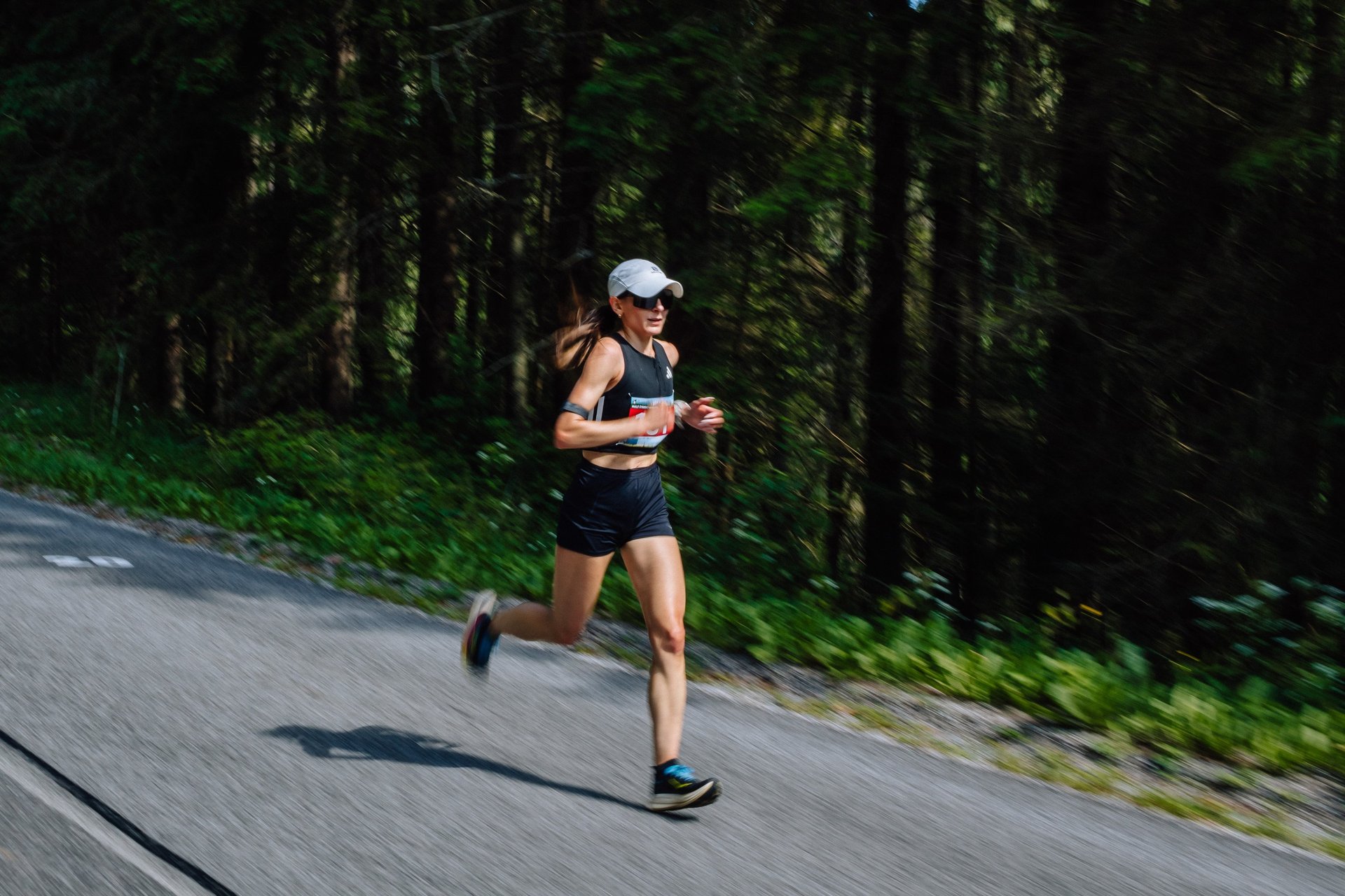 an abstract photo of a curved building with a blue sky in the background