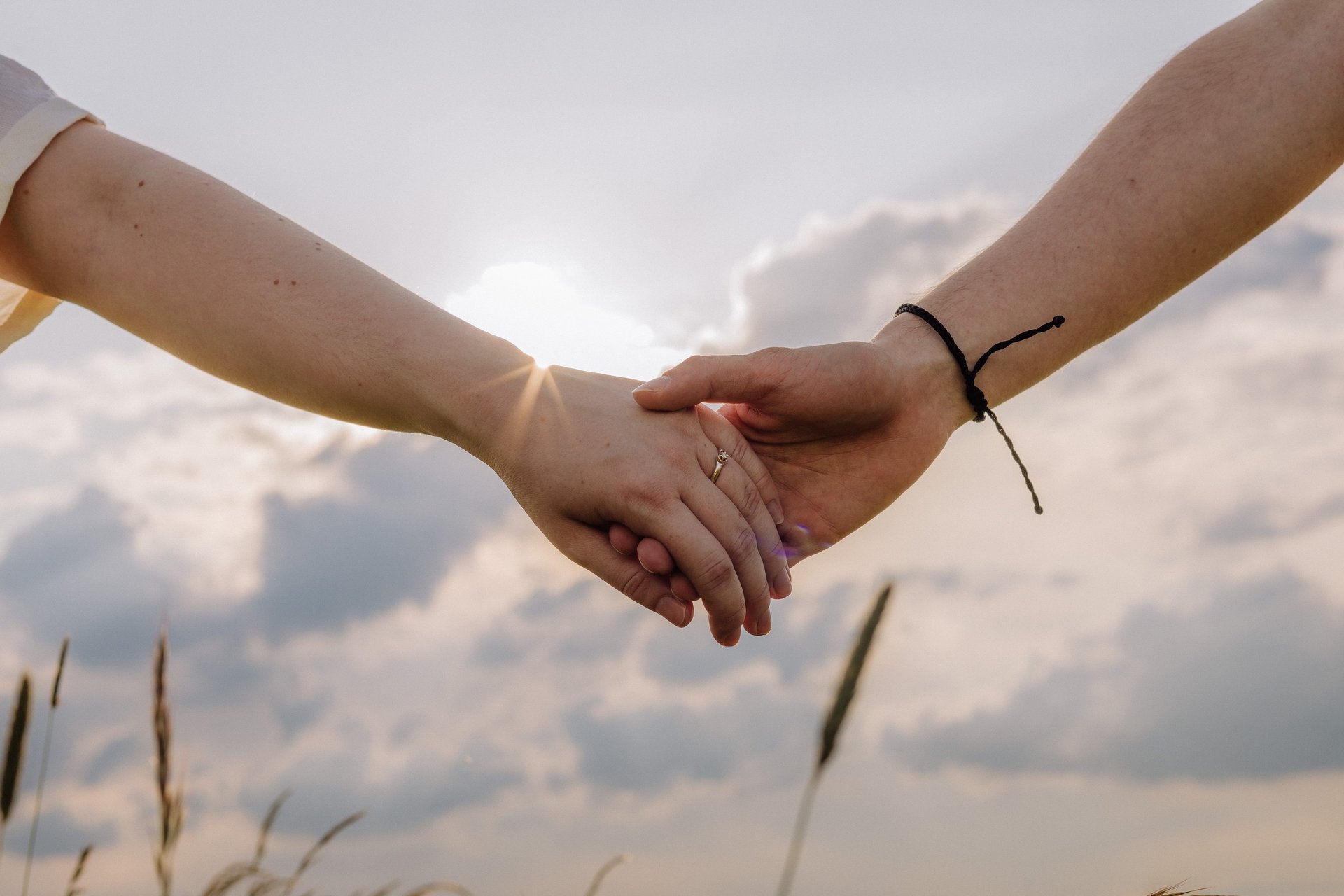 an abstract photo of a curved building with a blue sky in the background