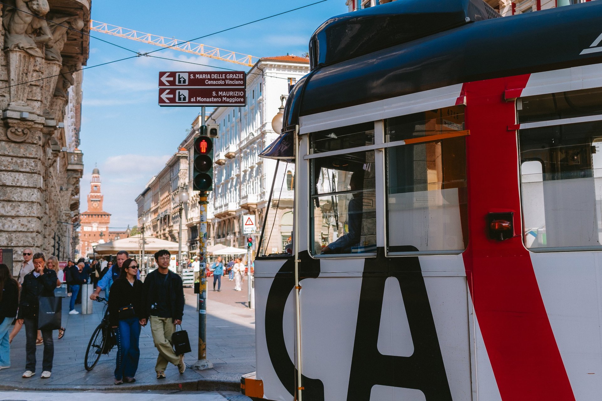 an abstract photo of a curved building with a blue sky in the background