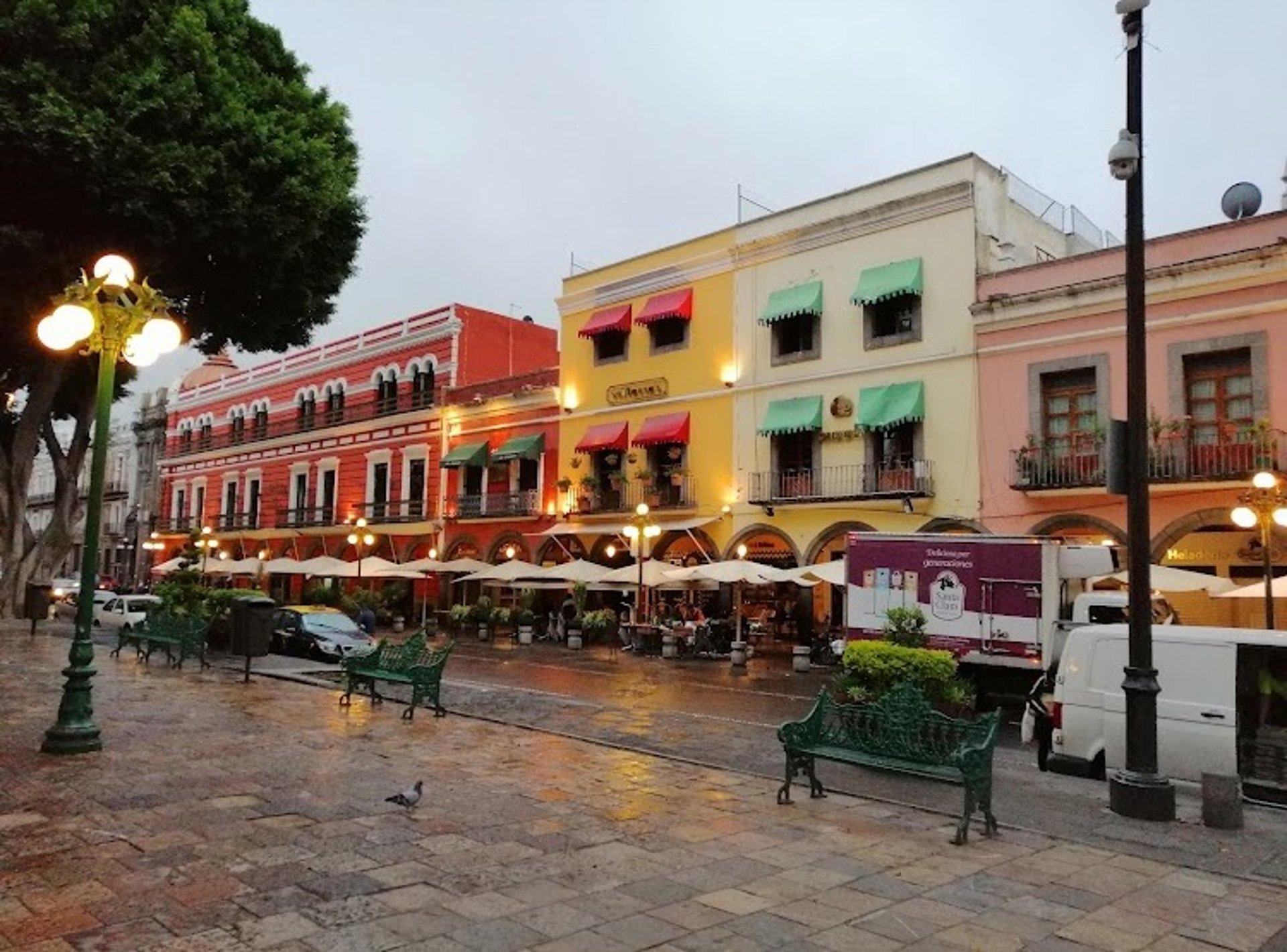 woman wearing yellow long-sleeved dress under white clouds and blue sky during daytime