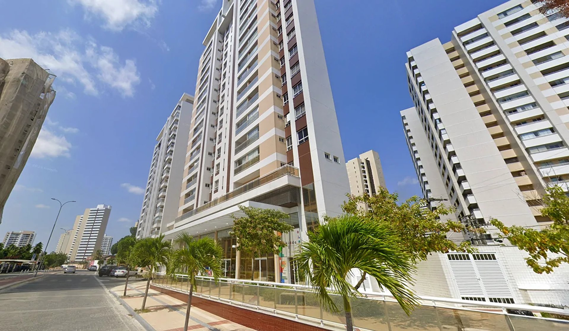 woman wearing yellow long-sleeved dress under white clouds and blue sky during daytime