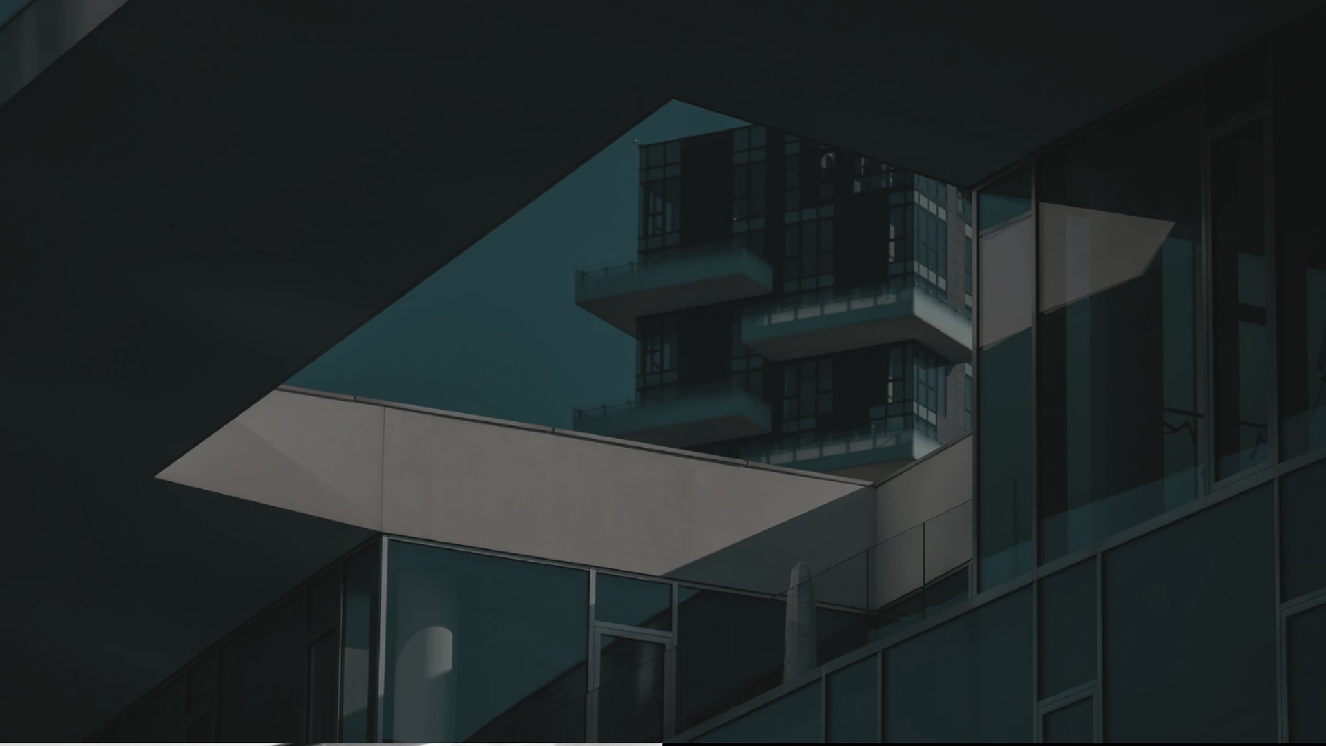 an abstract photo of a curved building with a blue sky in the background