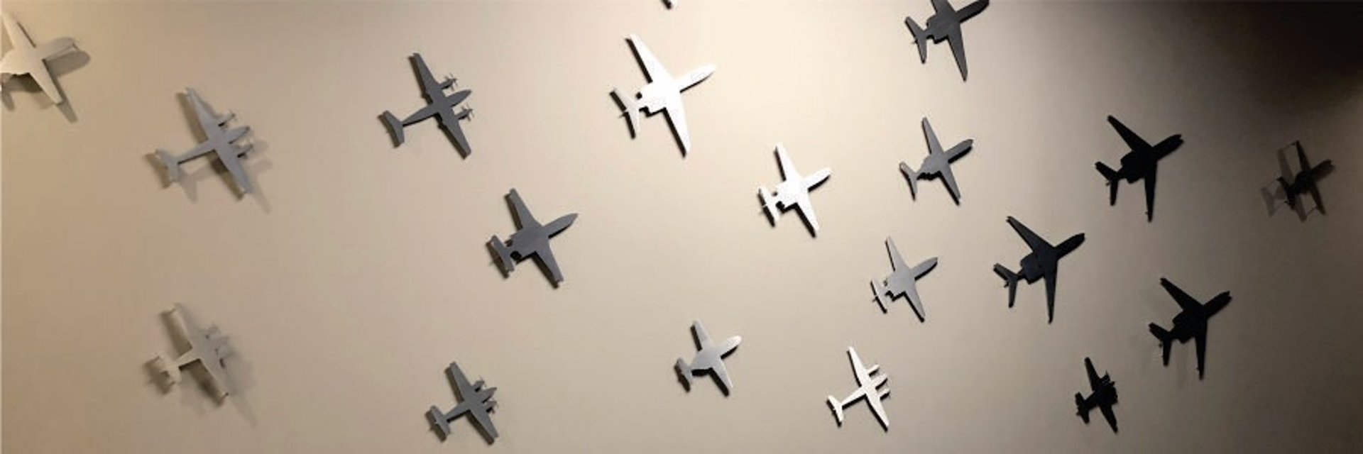 Custom routed brushed aluminum airplane shapes