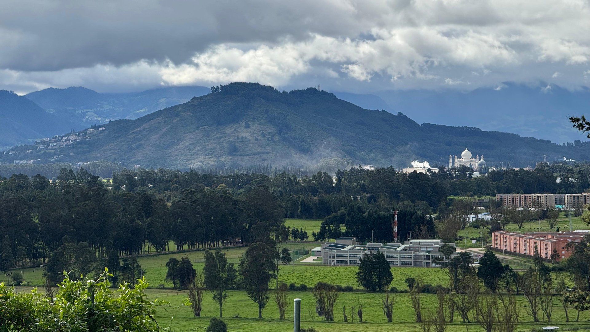 woman wearing yellow long-sleeved dress under white clouds and blue sky during daytime