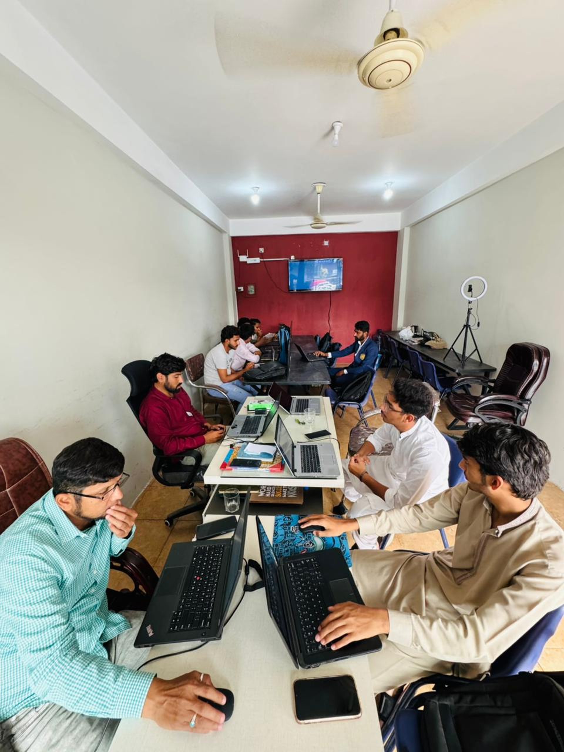 group of people using laptop computer