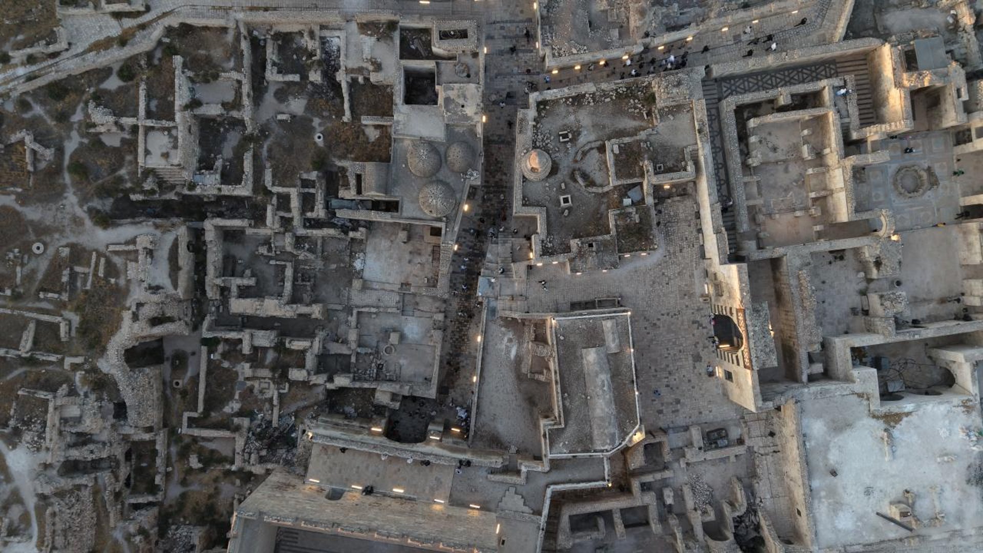 Old stone building covered in autumn ivy vines
