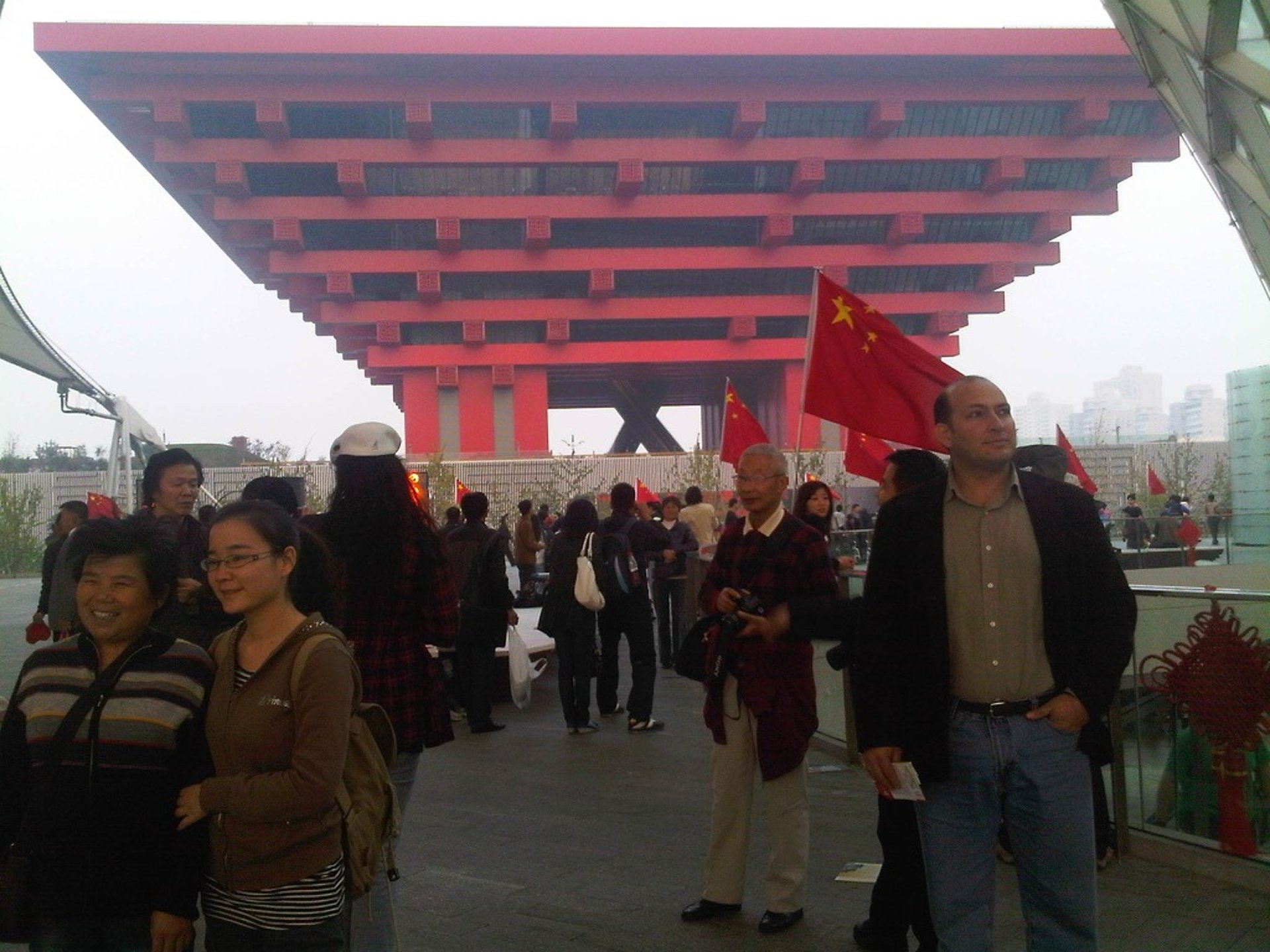 woman wearing yellow long-sleeved dress under white clouds and blue sky during daytime