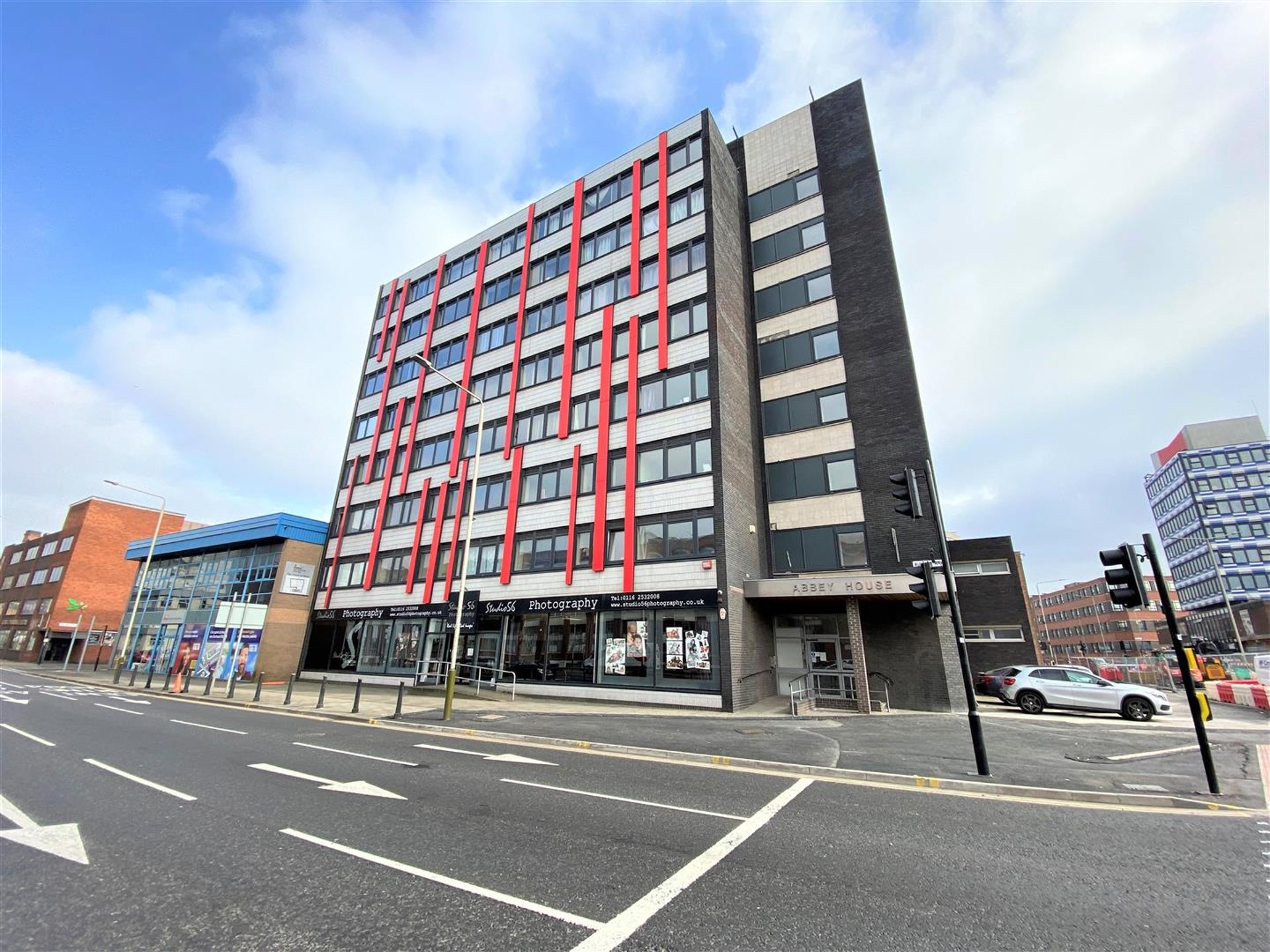 black and brown leather padded tub sofa