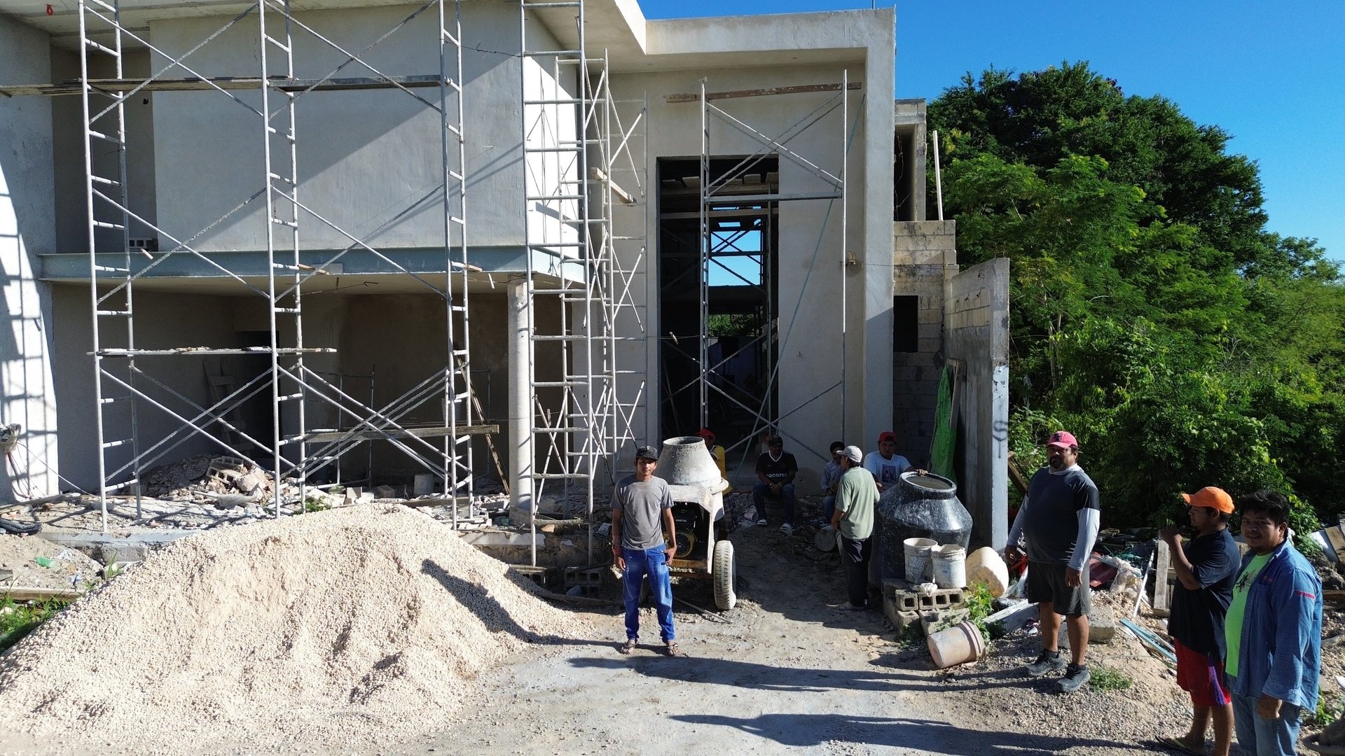 woman wearing yellow long-sleeved dress under white clouds and blue sky during daytime