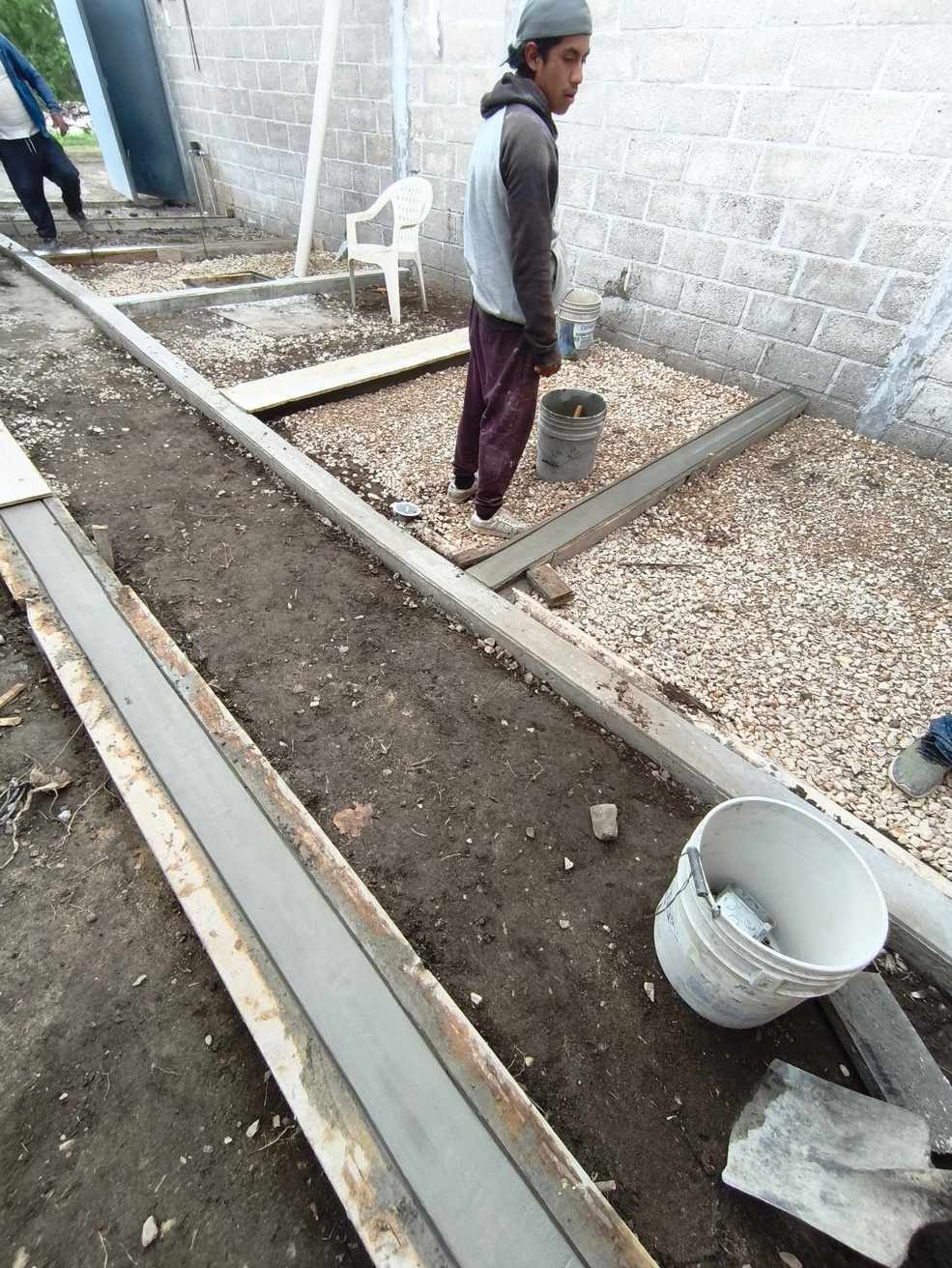 an abstract photo of a curved building with a blue sky in the background