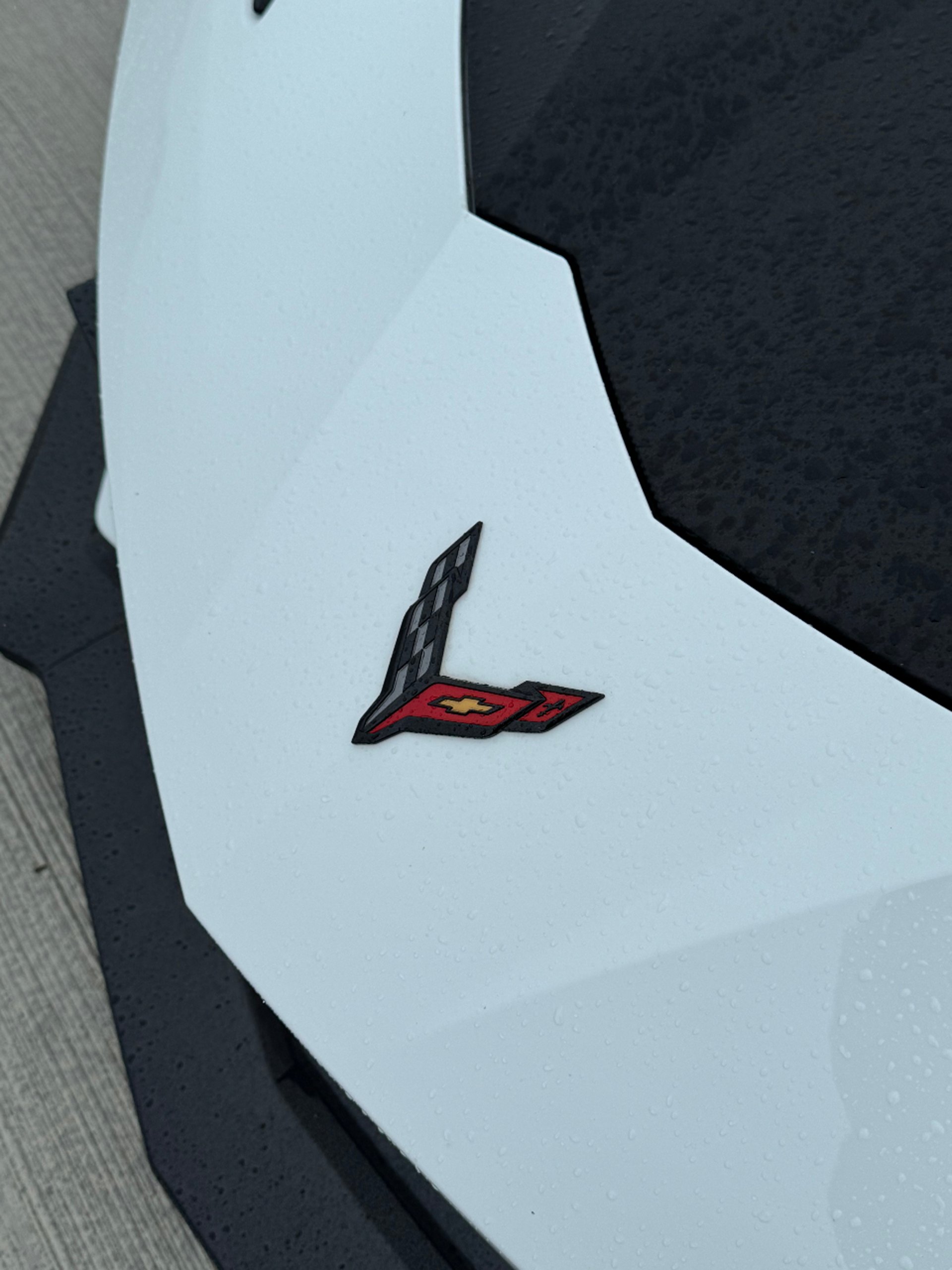 a close up of the hood of a red sports car