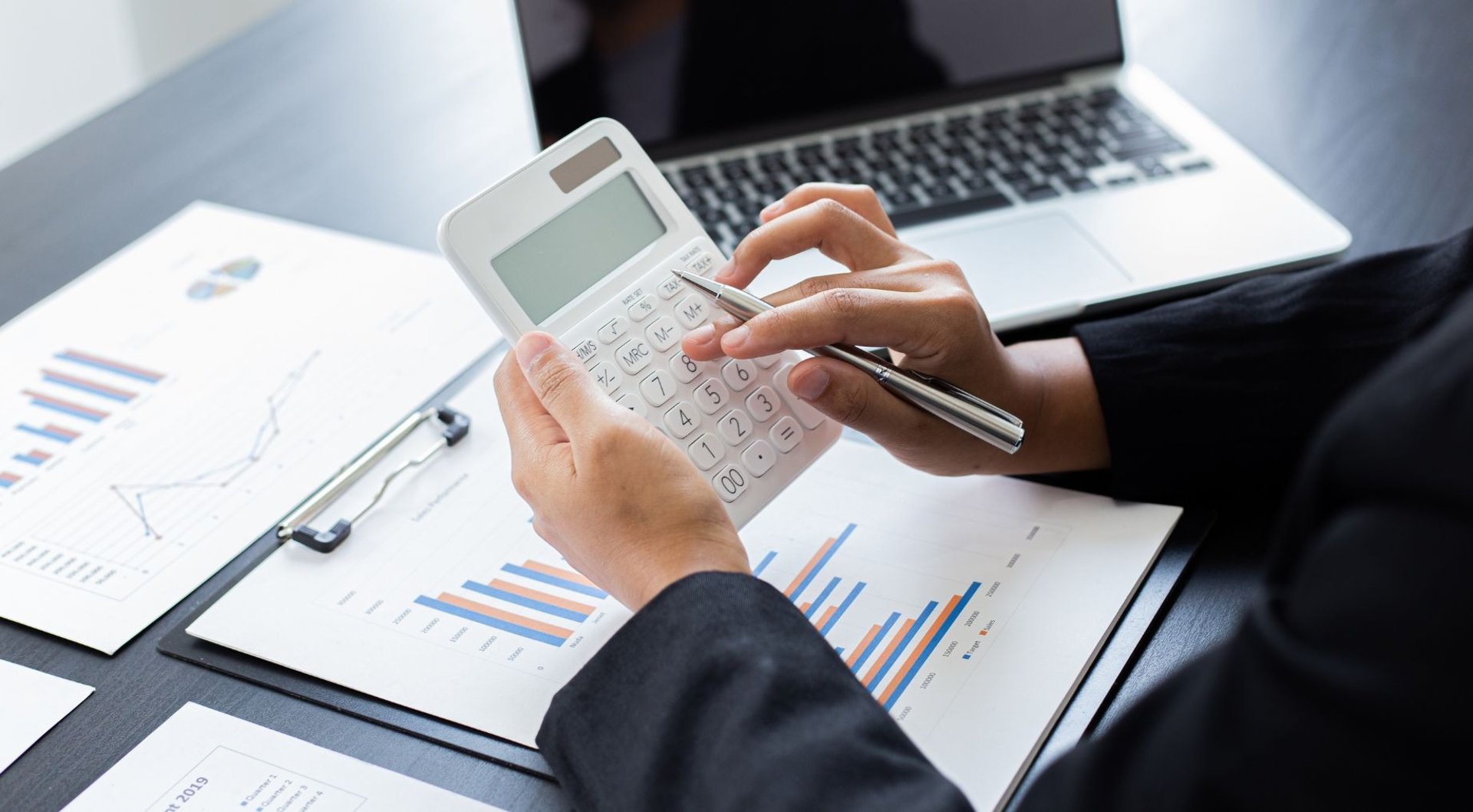 an abstract photo of a curved building with a blue sky in the background