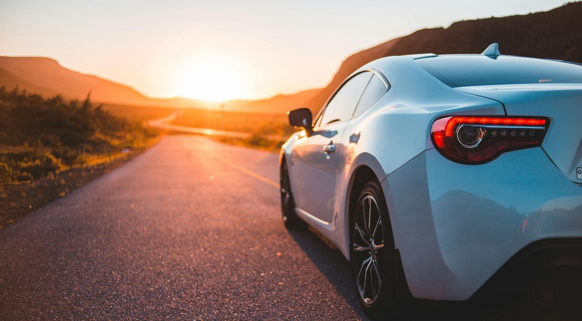 an abstract photo of a curved building with a blue sky in the background