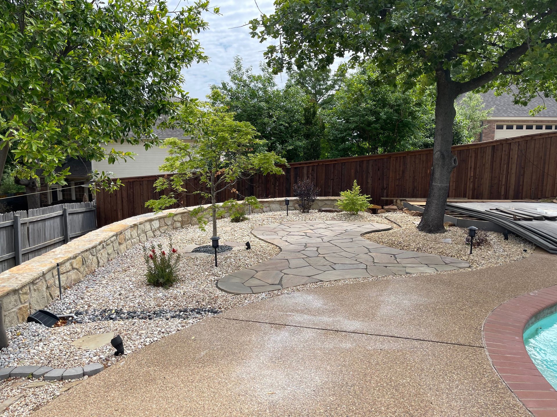 man wearing black jacket holding rod