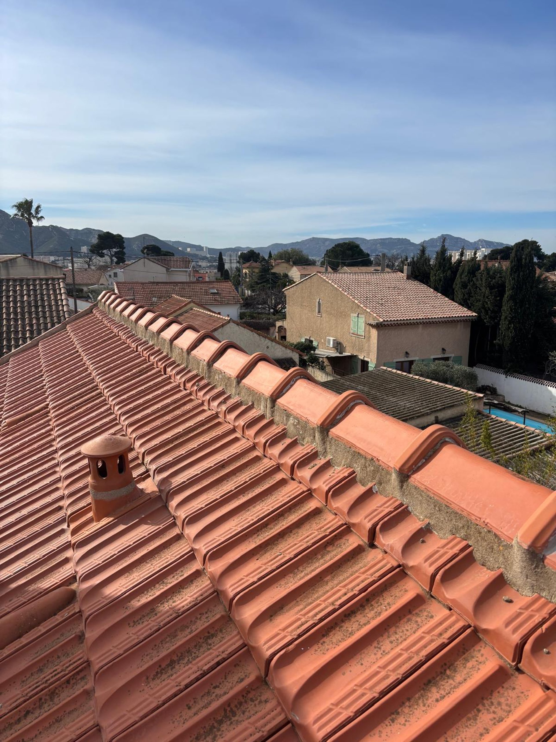 a person wearing blue gloves and holding a hammer