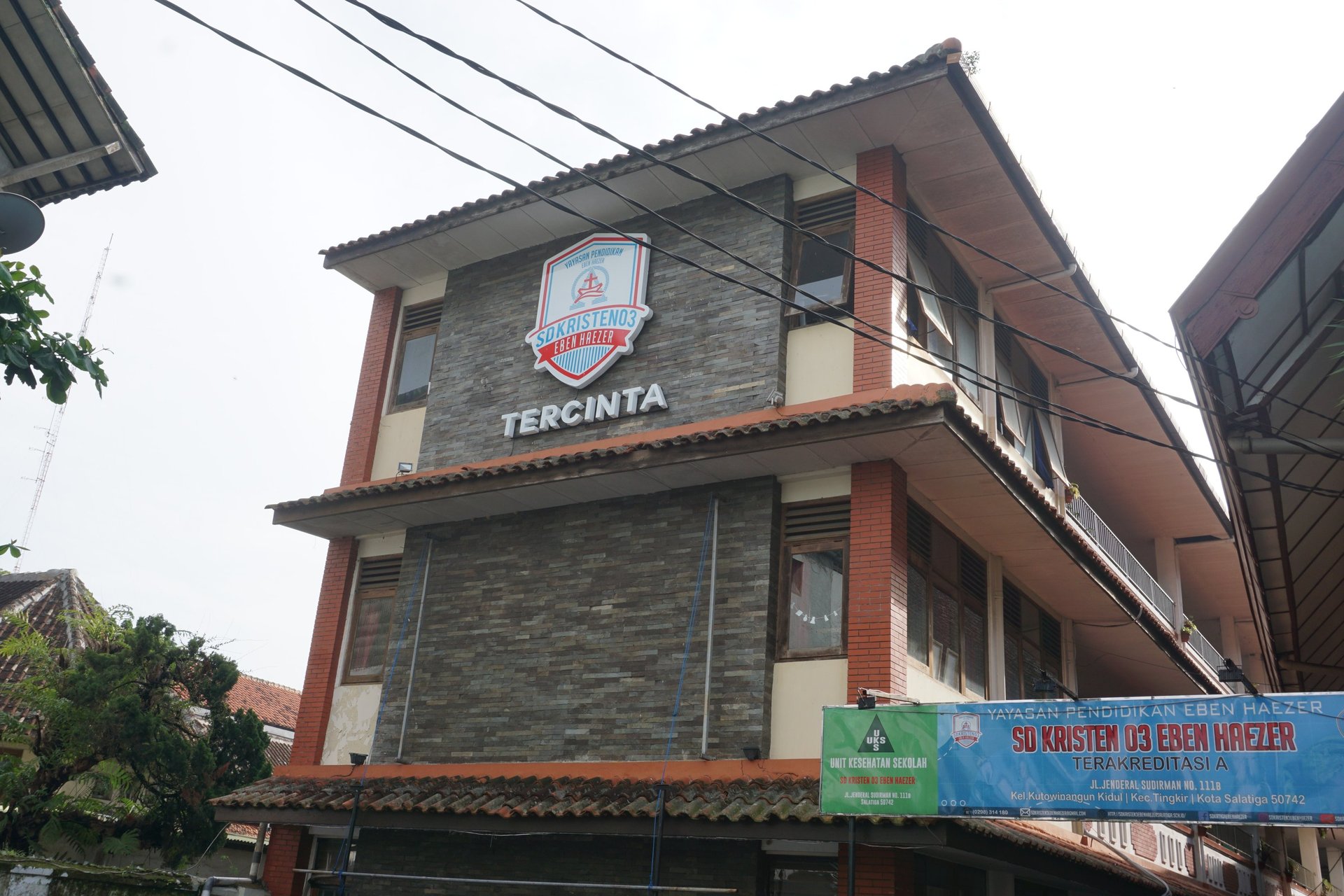 an abstract photo of a curved building with a blue sky in the background