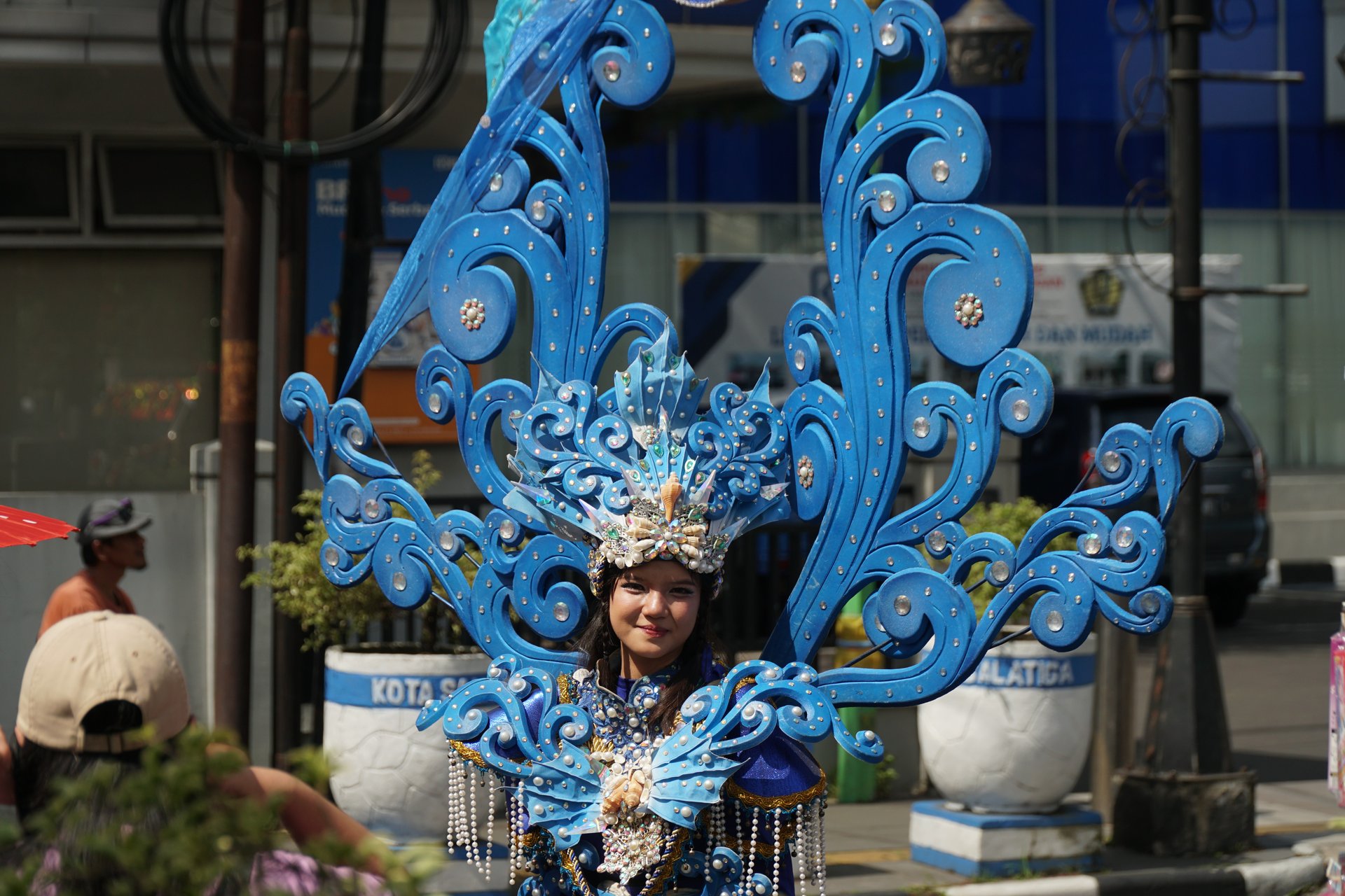 an abstract photo of a curved building with a blue sky in the background