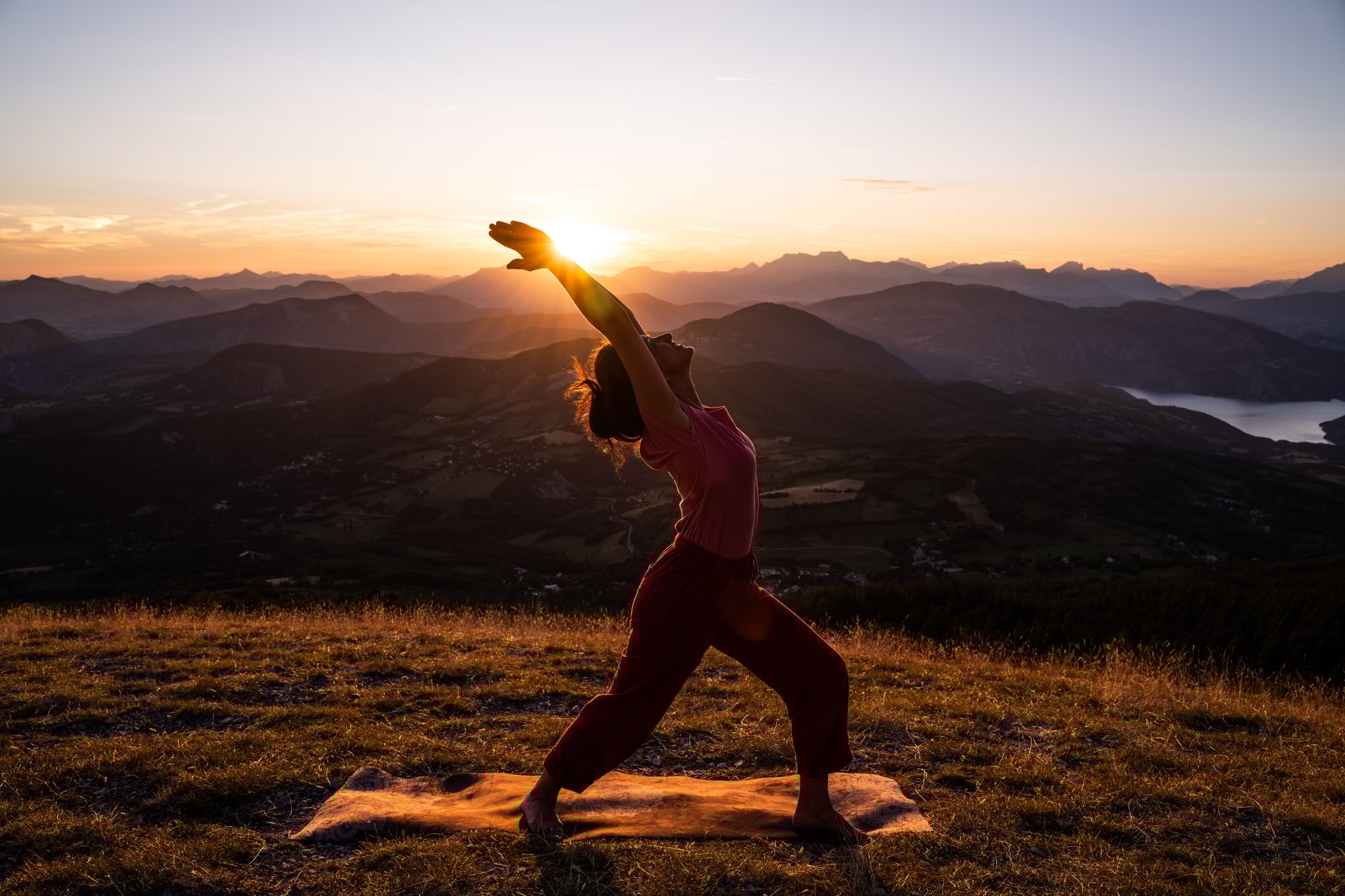 woman wearing yellow long-sleeved dress under white clouds and blue sky during daytime