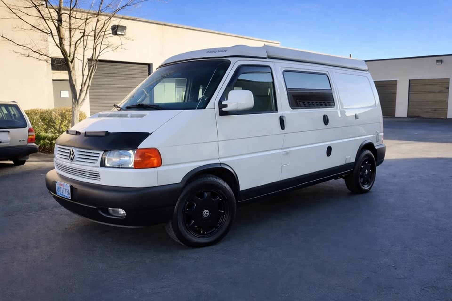 green volkswagen t-2 on road during daytime