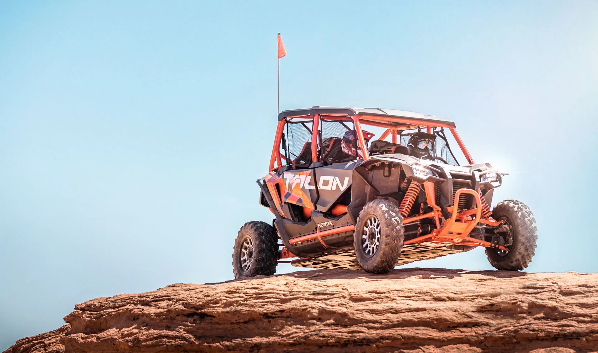 an abstract photo of a curved building with a blue sky in the background